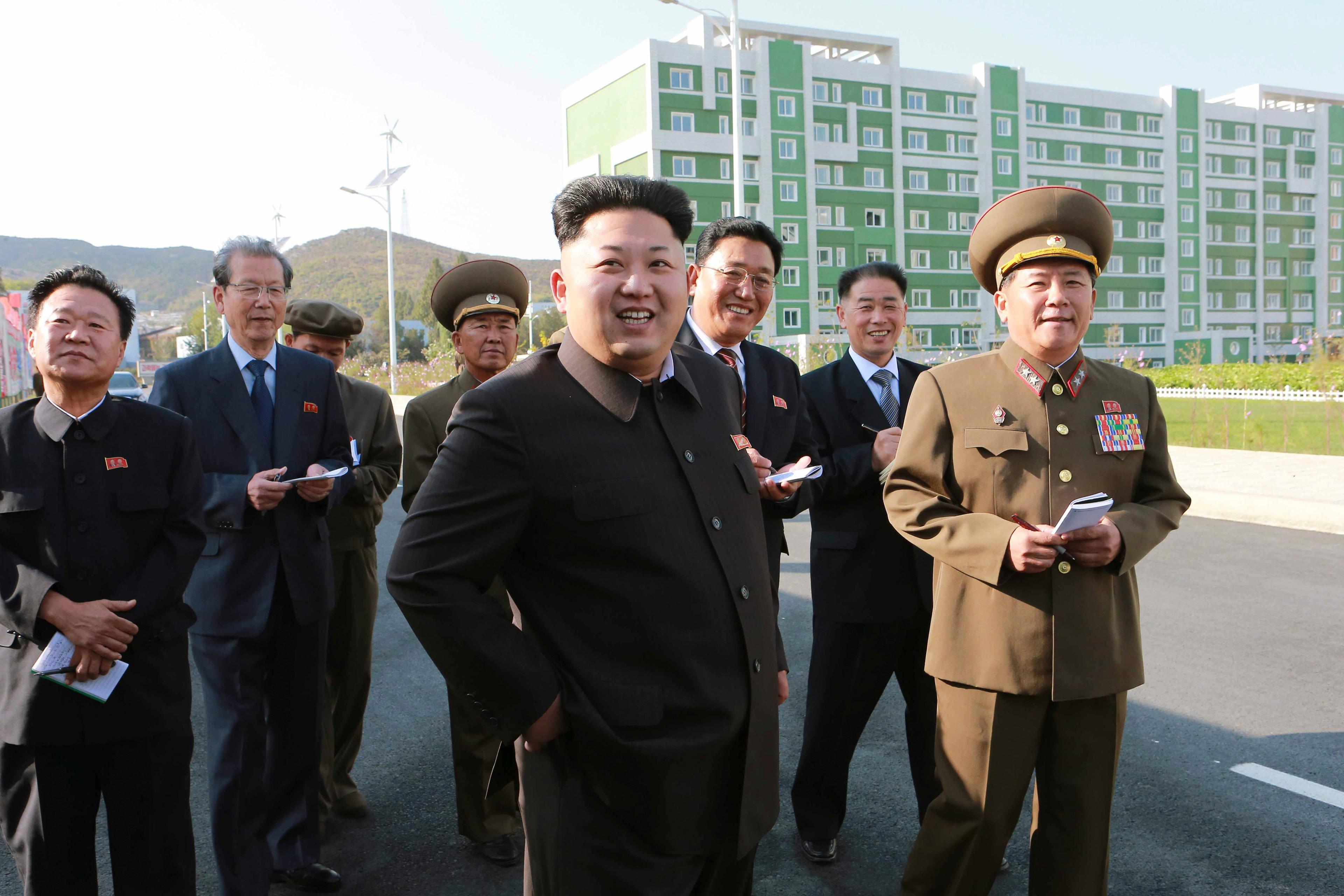 North Korean leader Kim Jong Un gives field guidance at the newly built Wisong Scientists Residential District in this undated photo released by KCNA
