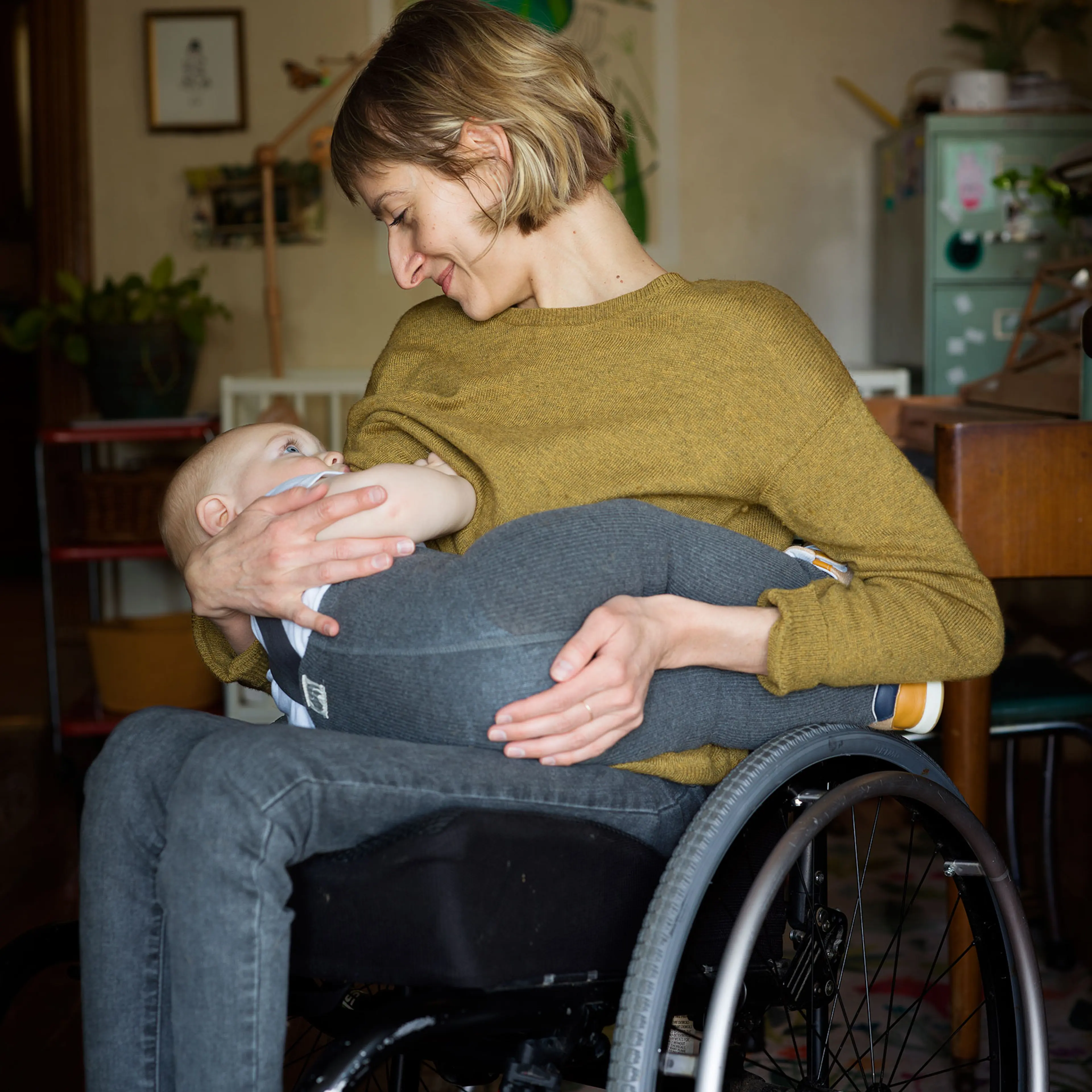 Rebekah Taussig breastfeeds her son, Otto, in their home in April 2021.