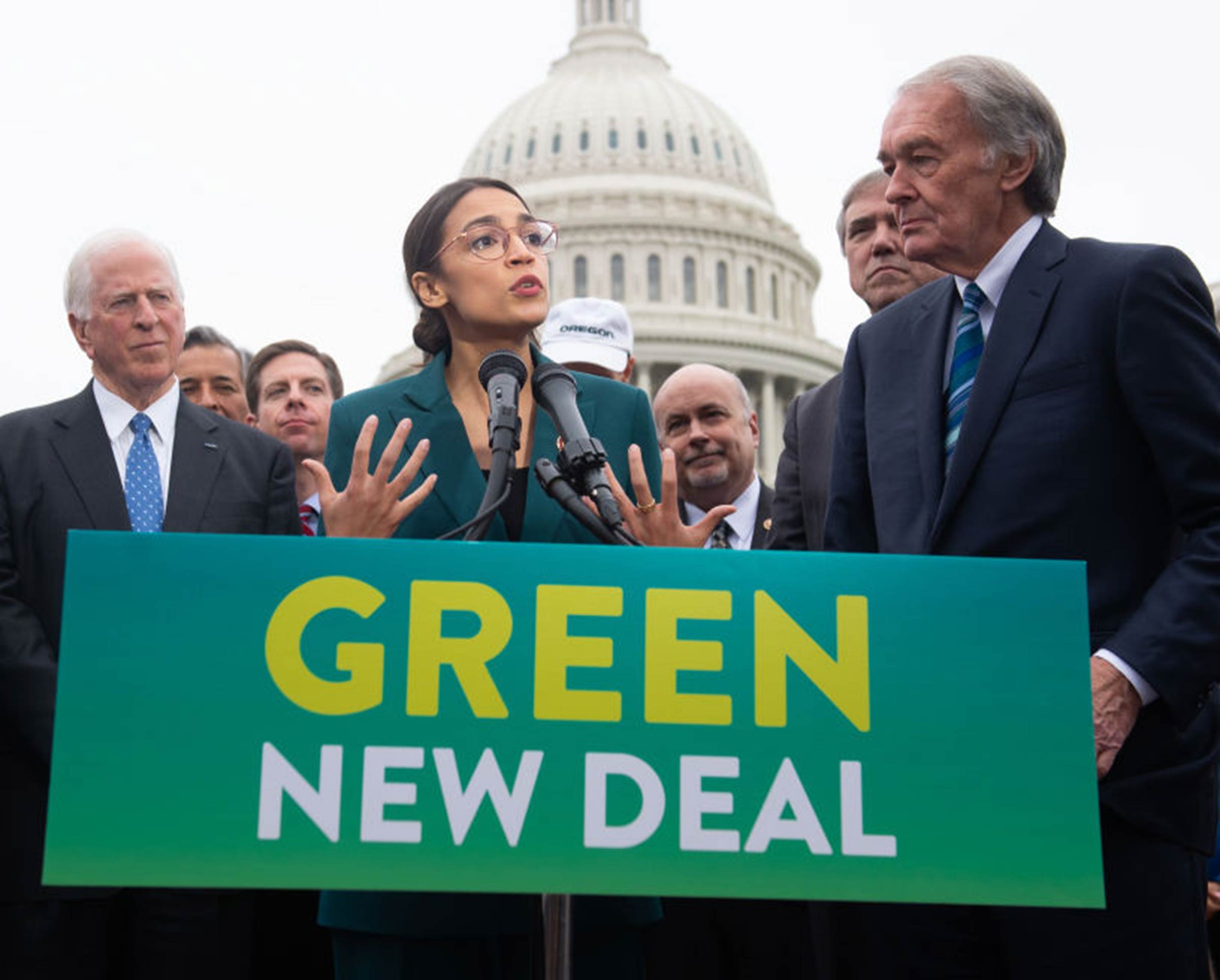 U.S. Representative Alexandria Ocasio-Cortez, Democrat of New York, and U.S. Senator Ed Markey (R), Democrat of Massachusetts, speak during a press conference to announce Green New Deal legislation to promote clean energy programs outside the U.S. Capitol in Washington, DC, on Feb. 7, 2019.