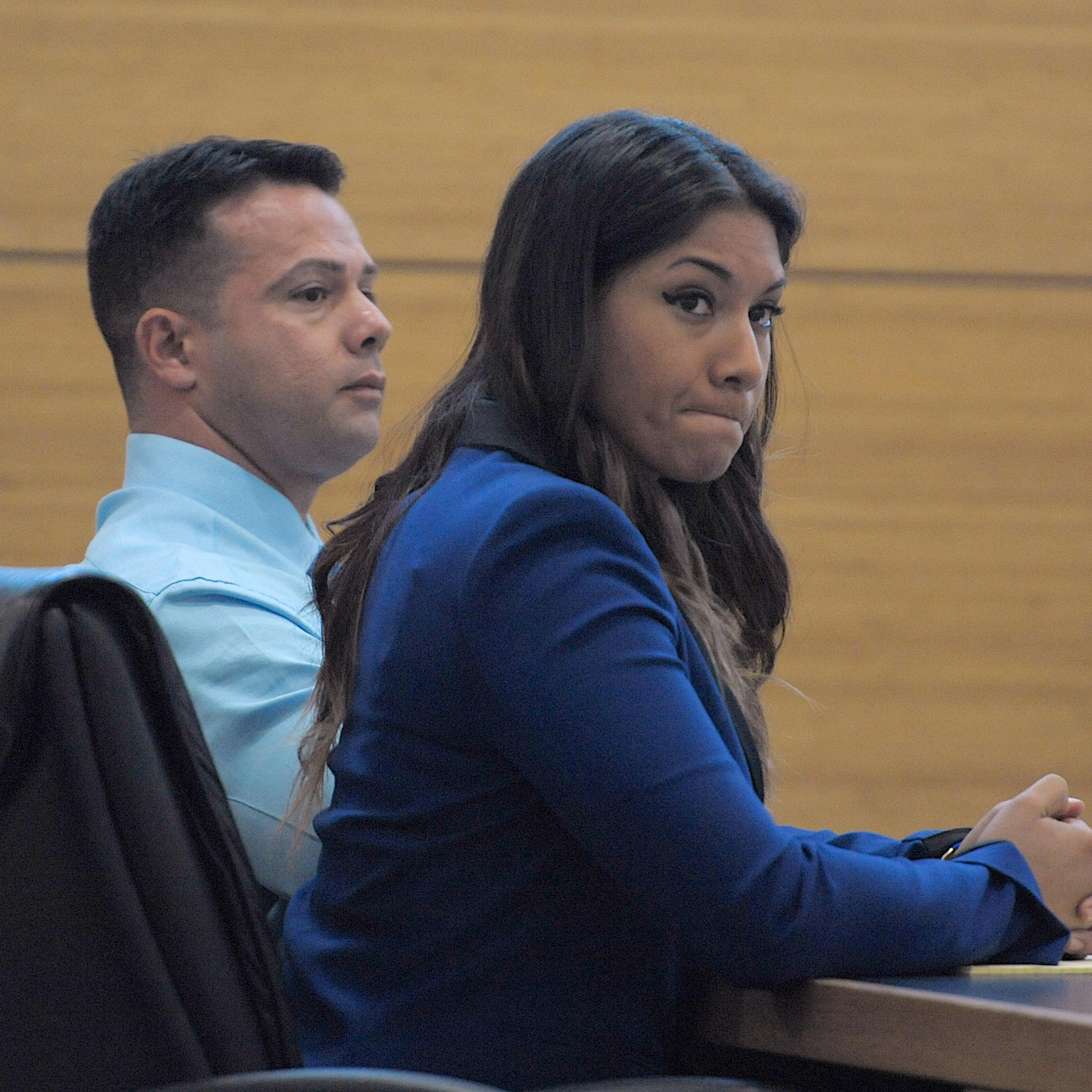Elissa Alvarez, 20, right, and Jose Caballero, 40, listen to witness testimony during their trial for lewd and lascivious exhibition on May 1, 2015, at the Manatee County Judicial Center in Bradenton.