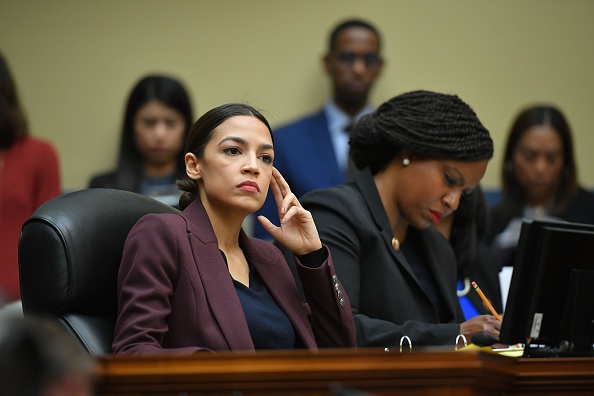 US Congresswoman Alexandria Ocasio-Cortez(D-NY) listens as Michael Cohen, attorney for President Trump, testifies