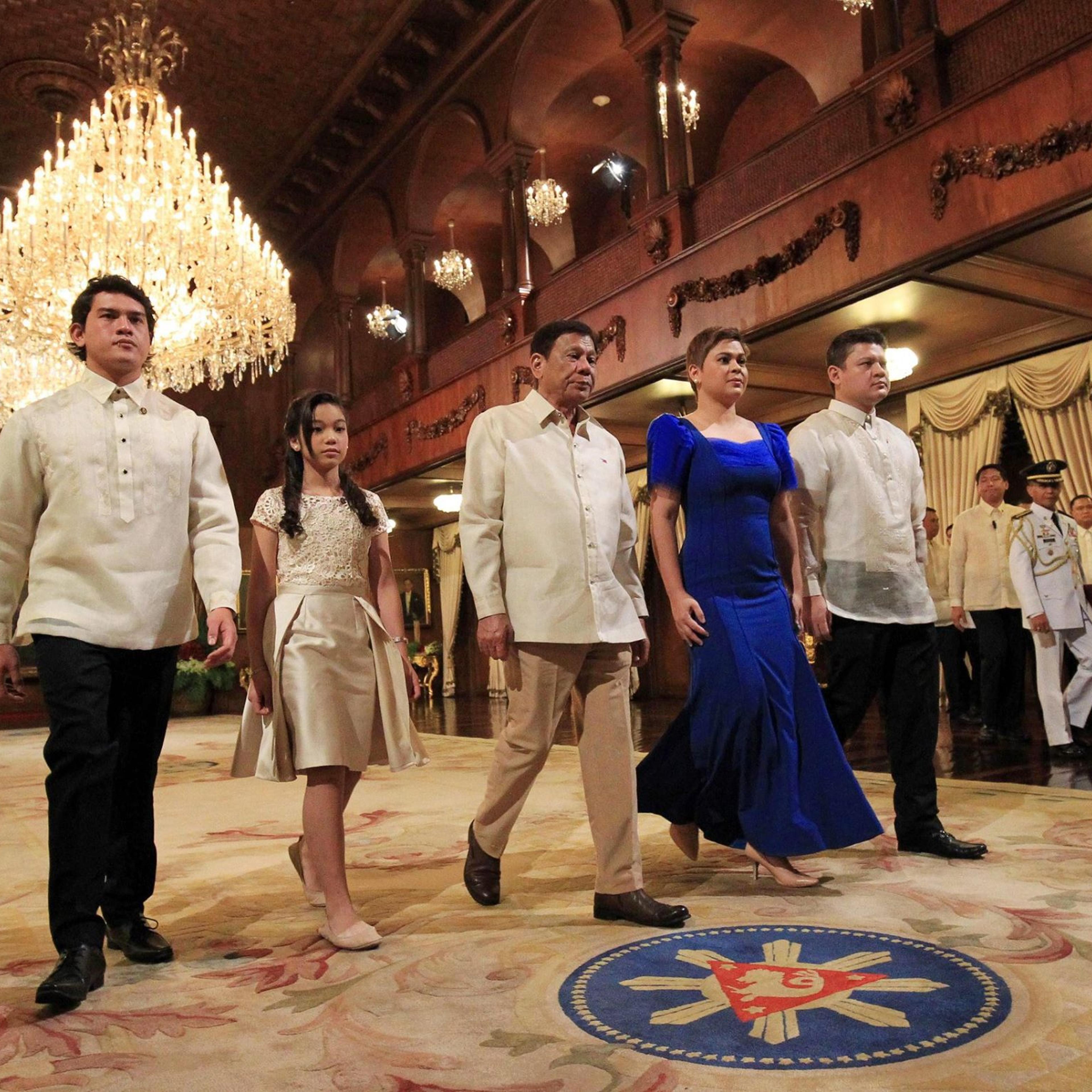In this photo from 2016, President Rodrigo Duterte (C) walks with his children (L-R) Sebastian, Veronica, Sara, and Paolo at Malacanang Palace in Manila, Philippines.