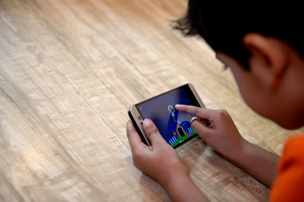 Kid Using Ipad Under Parental Supervision