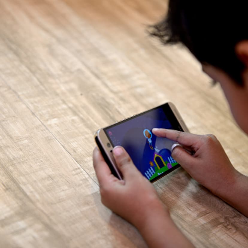 Kid Using Ipad Under Parental Supervision