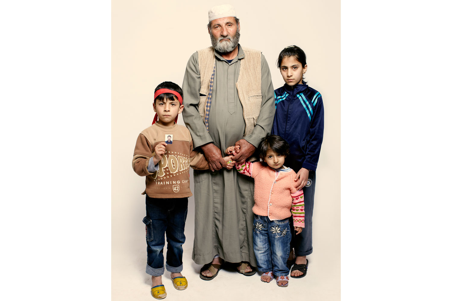 <b>Jamil Wassouf and his grandchildren Tayma, Mohammad and Israa</b><br><br>"The security forces came and took my son. He wasn't a revolutionary. He was martyred 10 days ago. They took him, they killed him but what they did with his body, we don't know."