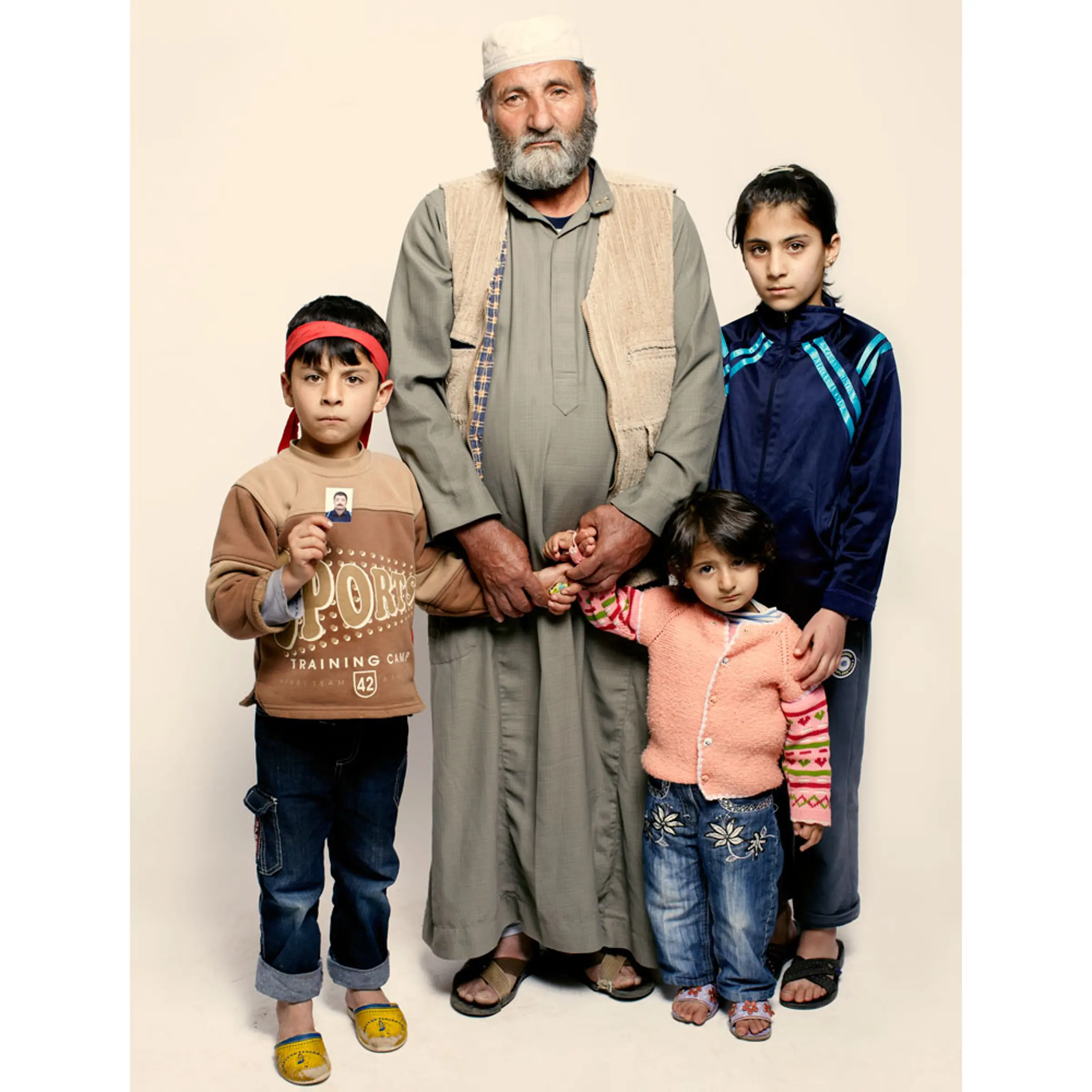 <b>Jamil Wassouf and his grandchildren Tayma, Mohammad and Israa</b><br><br>"The security forces came and took my son. He wasn't a revolutionary. He was martyred 10 days ago. They took him, they killed him but what they did with his body, we don't know."