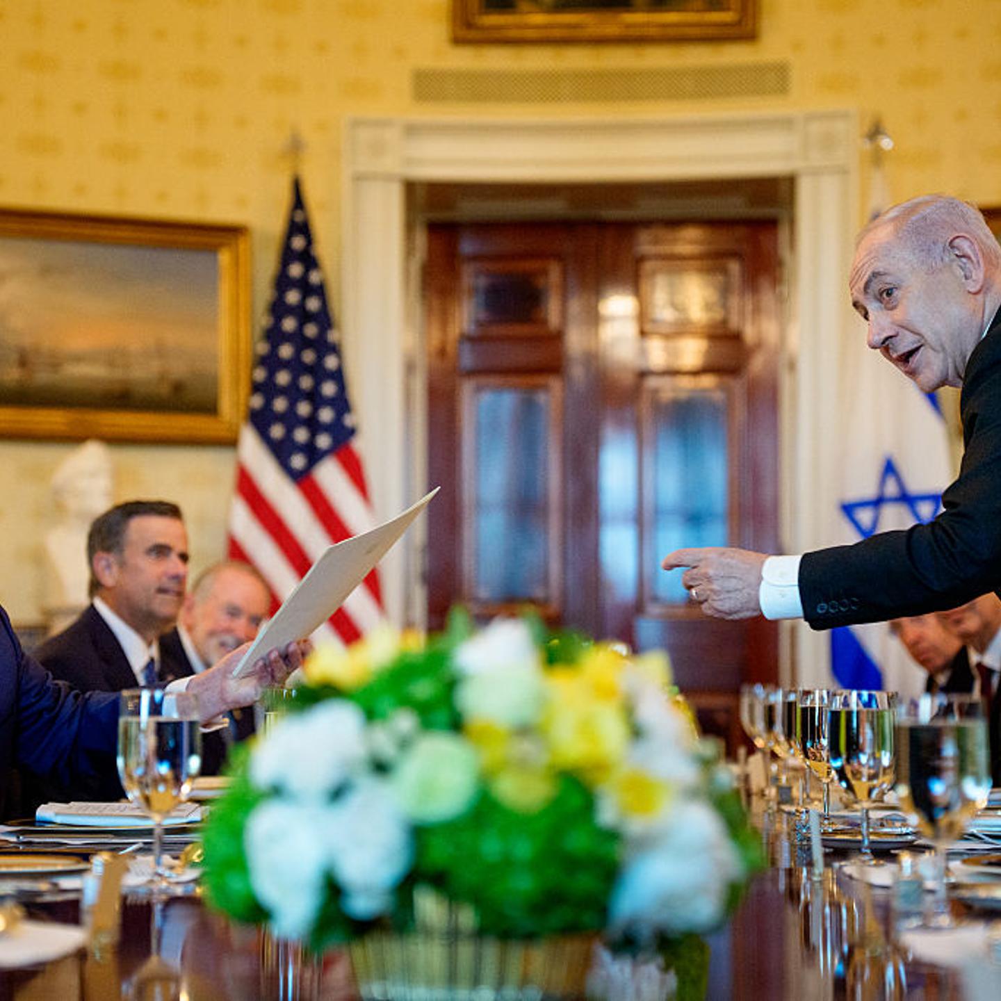 Israeli Prime Minister Benjamin Netanyahu (R) hands off a letter Netanyahu sent to the Nobel Peace Prize committee to nominate U.S. President Donald Trump (L) for the Nobel Peace Prize during a dinner in the Blue Room of the White House in Washington, D.