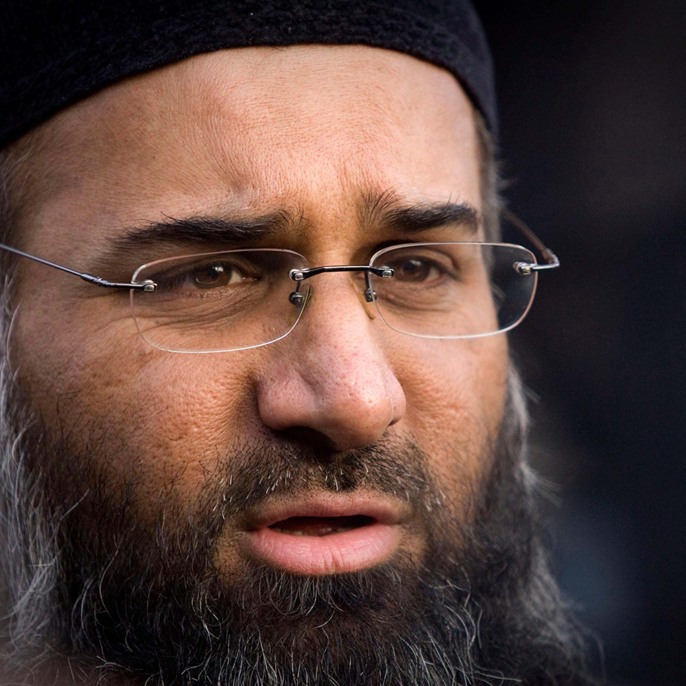 File photograph shows Muslim preacher Choudary addressing members of the media during a protest supporting Shari'ah Law in north London