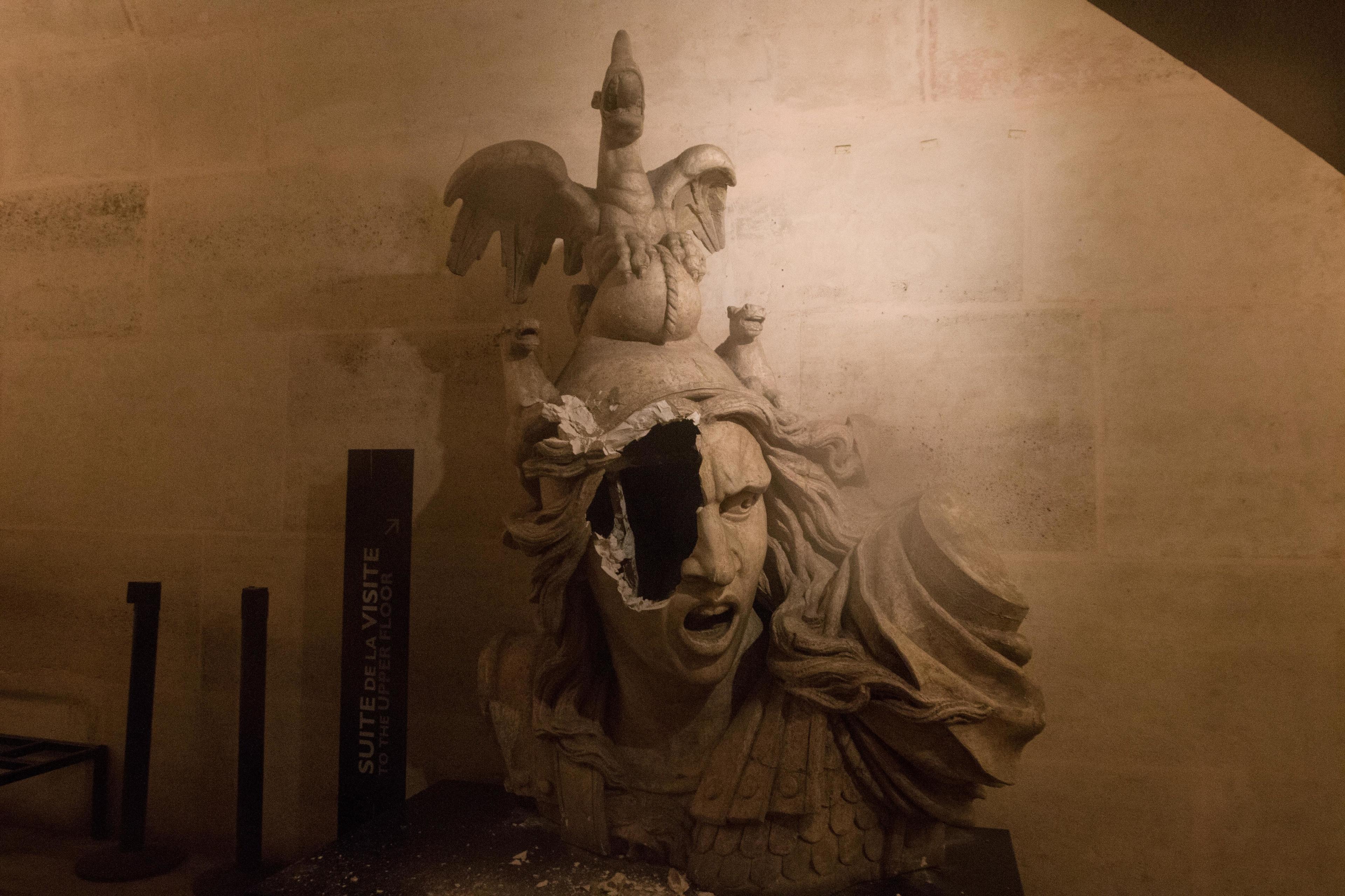 A statue seen broken near the Arc De Triomphe during a '