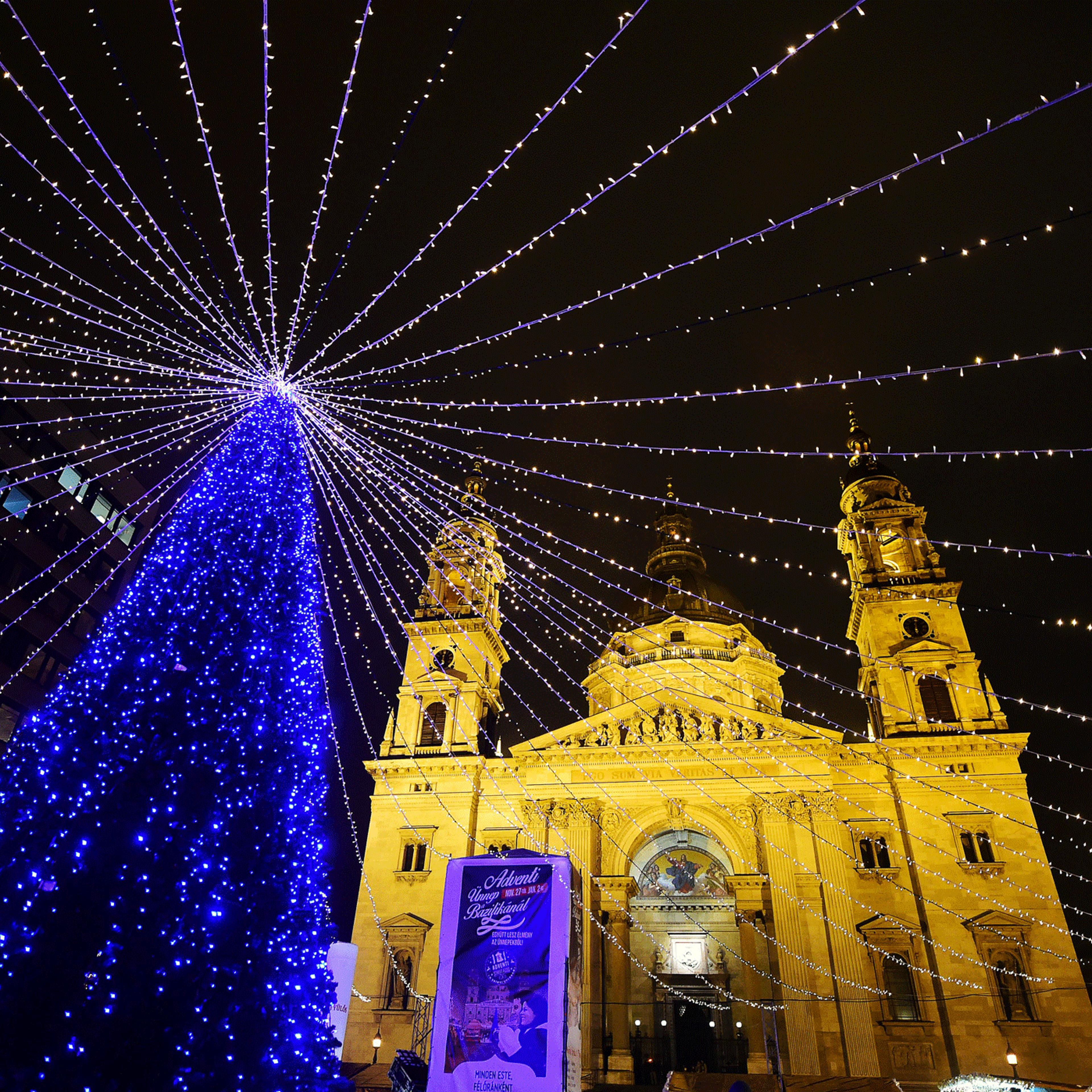 A Christmas tree is lit in front of the St, Stephan Basilica in Budapest on Dec. 21, 2015.