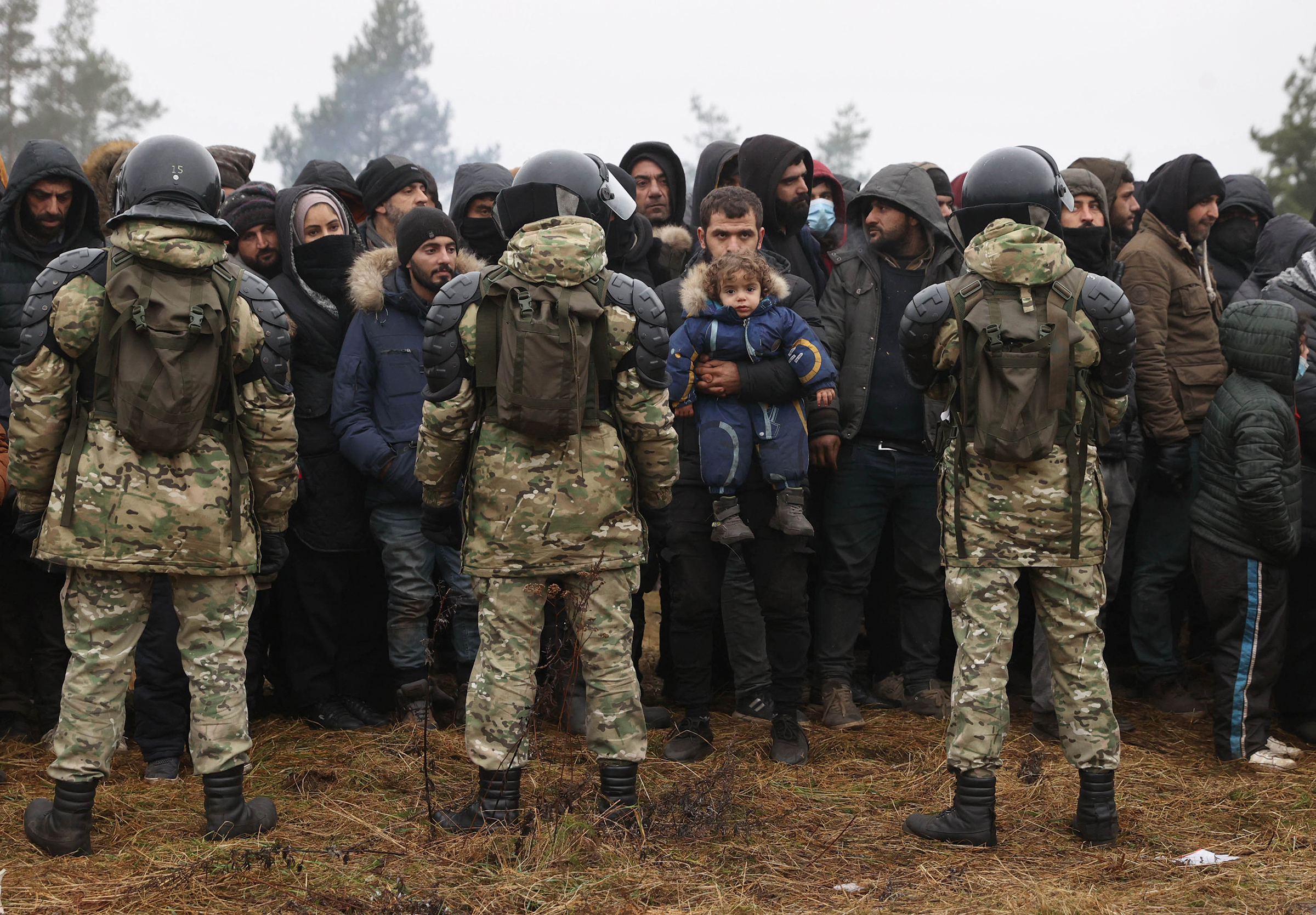 Migrants gather to receive humanitarian aid in Grodno Region on the Belarusian-Polish border, Nov. 14.