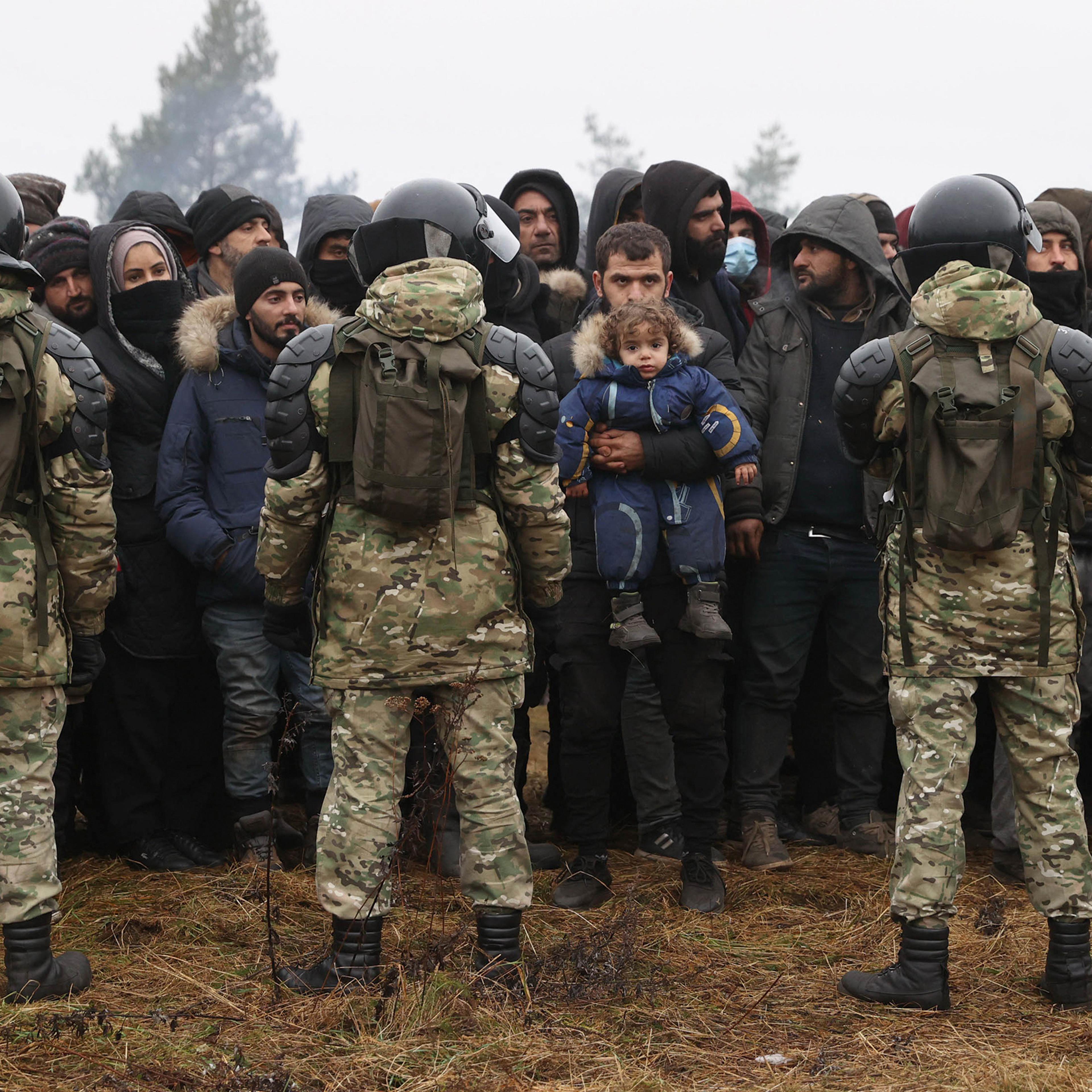 Migrants gather to receive humanitarian aid in Grodno Region on the Belarusian-Polish border, Nov. 14.