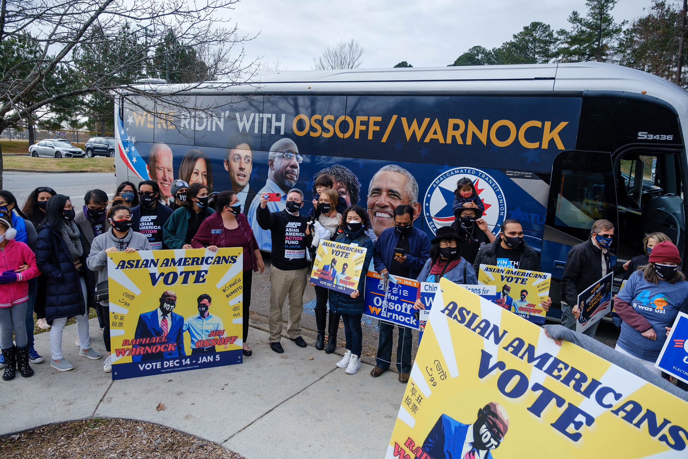 Supporters of Democratic senate candidates Rev. Raphael Warnock and Jon Ossoff gather at Shorty Howell Park in Duluth, Georgia on Dec. 20 for a "K-Pop Dance Rally" early voting event. The event was organized by the Georgia chapter of the Asian American A