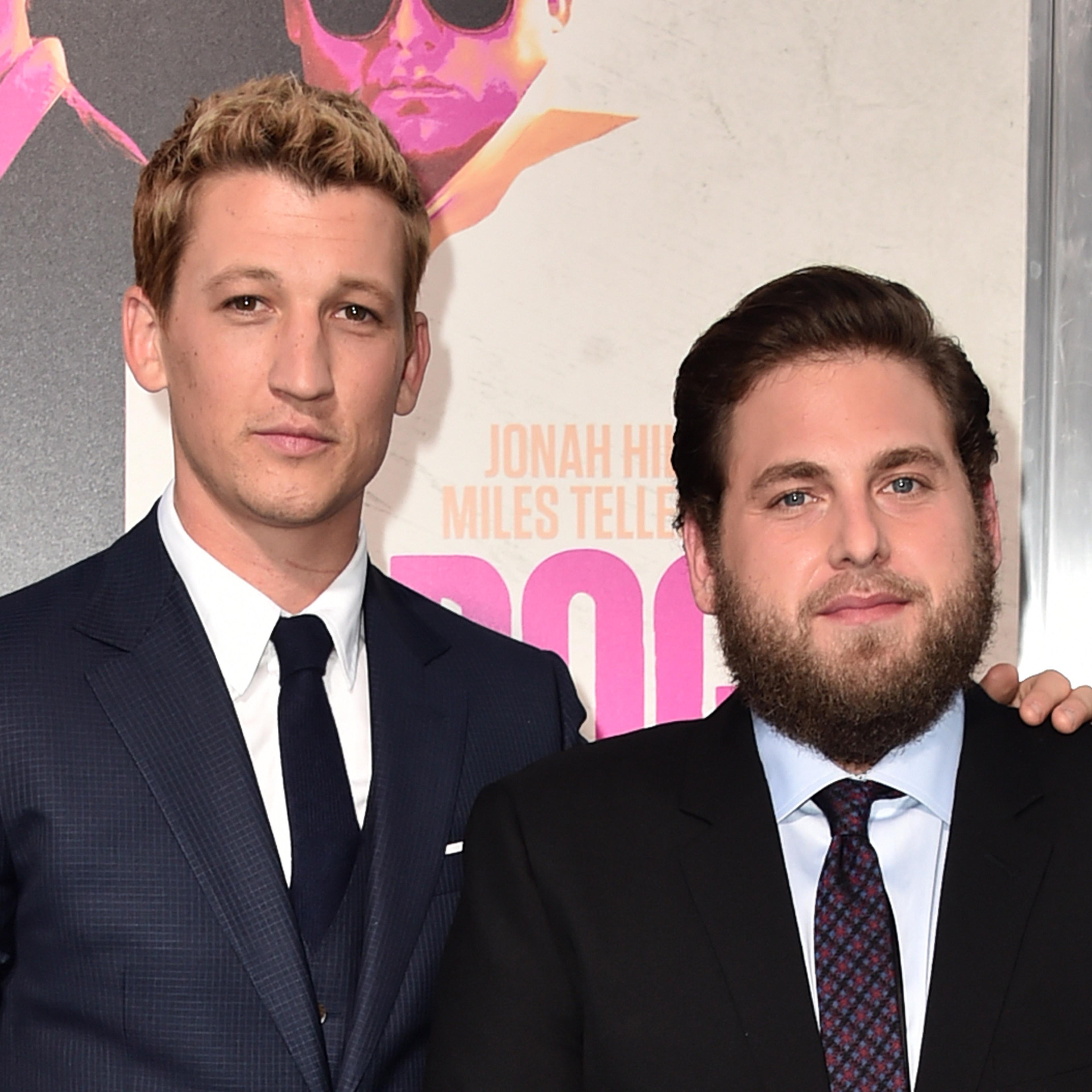 Actors Miles Teller (L) and Jonah Hill attend the premiere of Warner Bros. Pictures' "War Dogs" at TCL Chinese Theatre on August 15, 2016 in Hollywood, California.