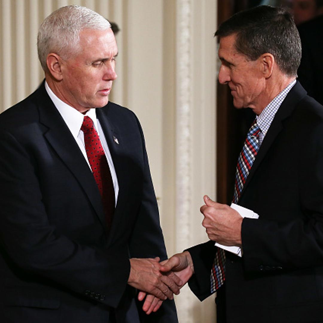 Vice President Mike Pence (L) shakes hands with National Security Adviser Michael Flynn before U.S. President Donald Trump and Japanese Prime Minister Shinzo Abe hold a joint press conference at the White House on February 10, 2017 in Washington, DC.