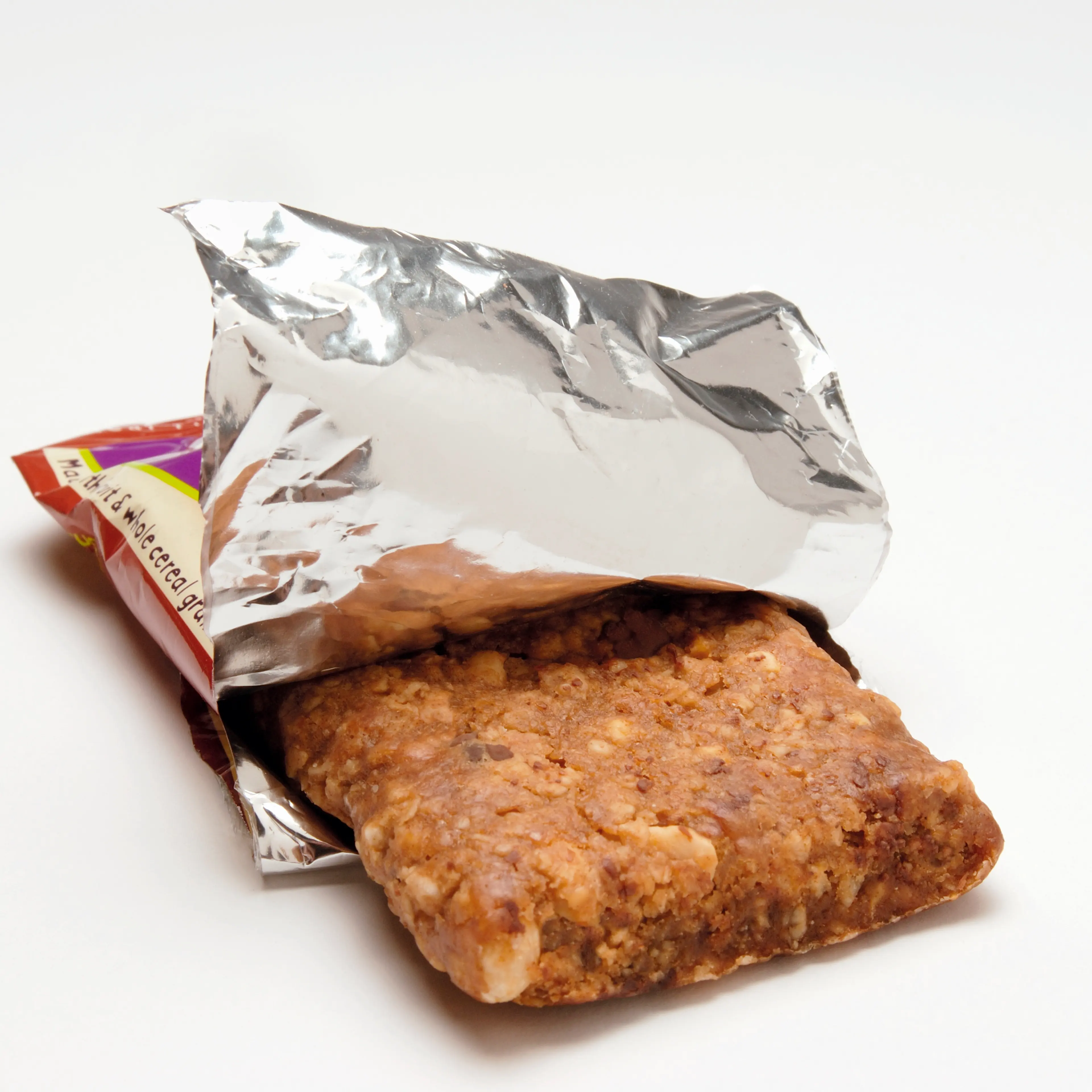Muesli bar in opened packaging