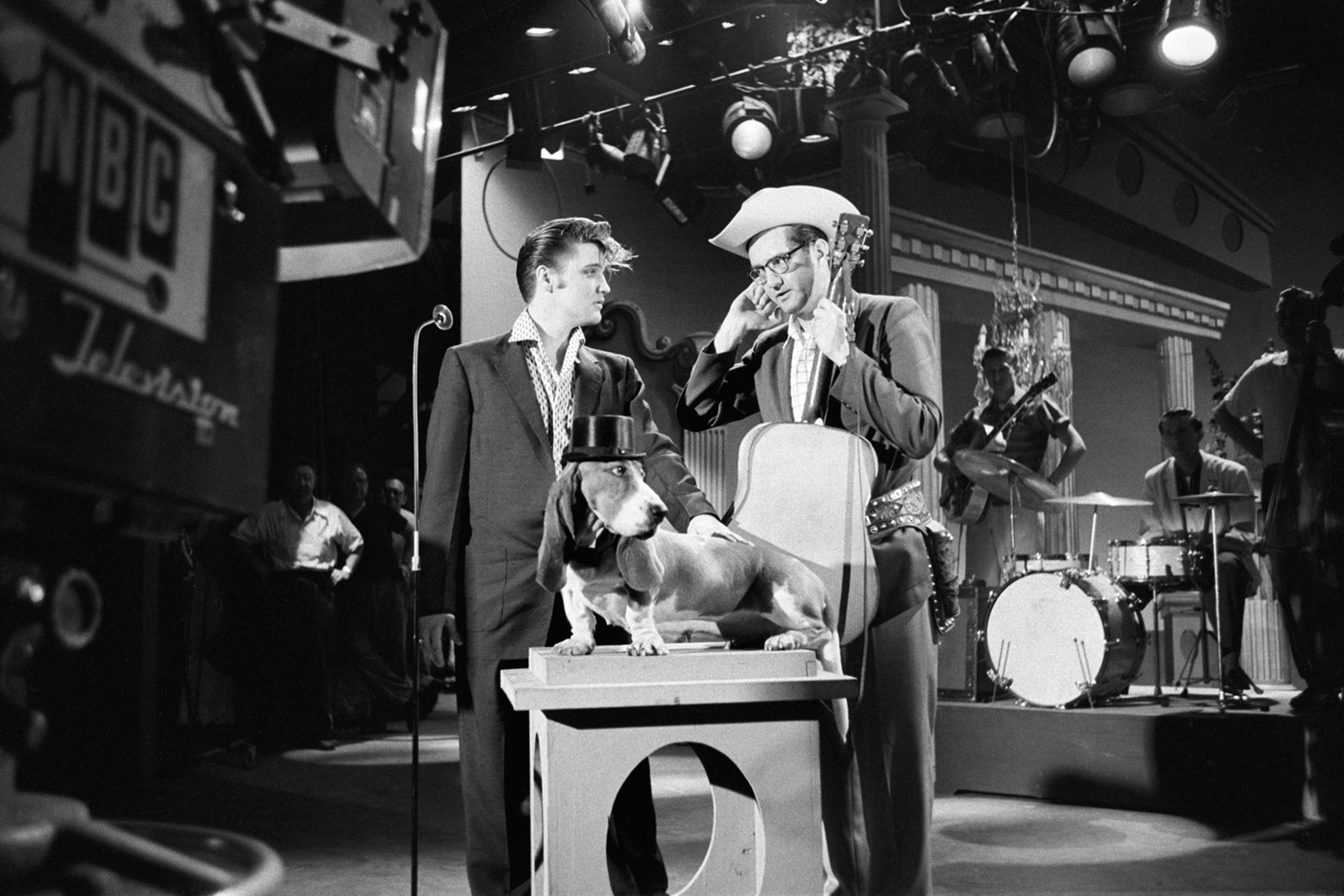 July 1, 1956. The Hudson Theatre, New York. Dress rehearsal for the Steve Allen Show. My classic show business photograph. Steve Allen with his six shooter, Elvis, a dog, guys with musical instruments, Greek columns, stage hands and lighting overhead. I just like the way all the elements come together — how could it be more theatrical?