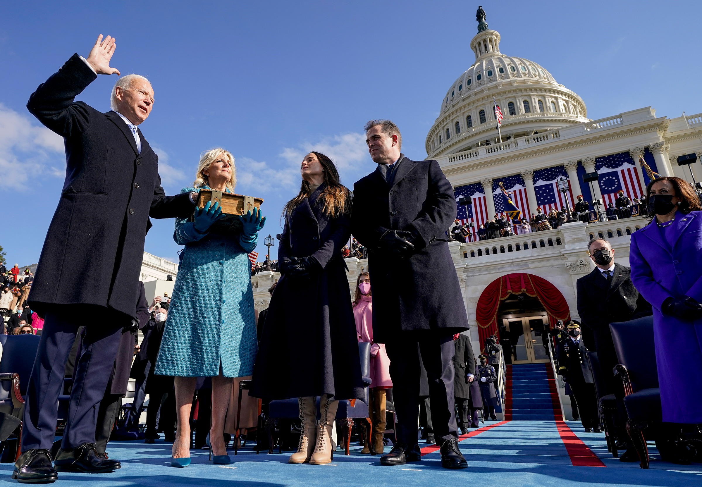 Joe Biden is sworn in as the 46th president of the United States by Chief Justice John Roberts as Jill Biden holds the Bible.