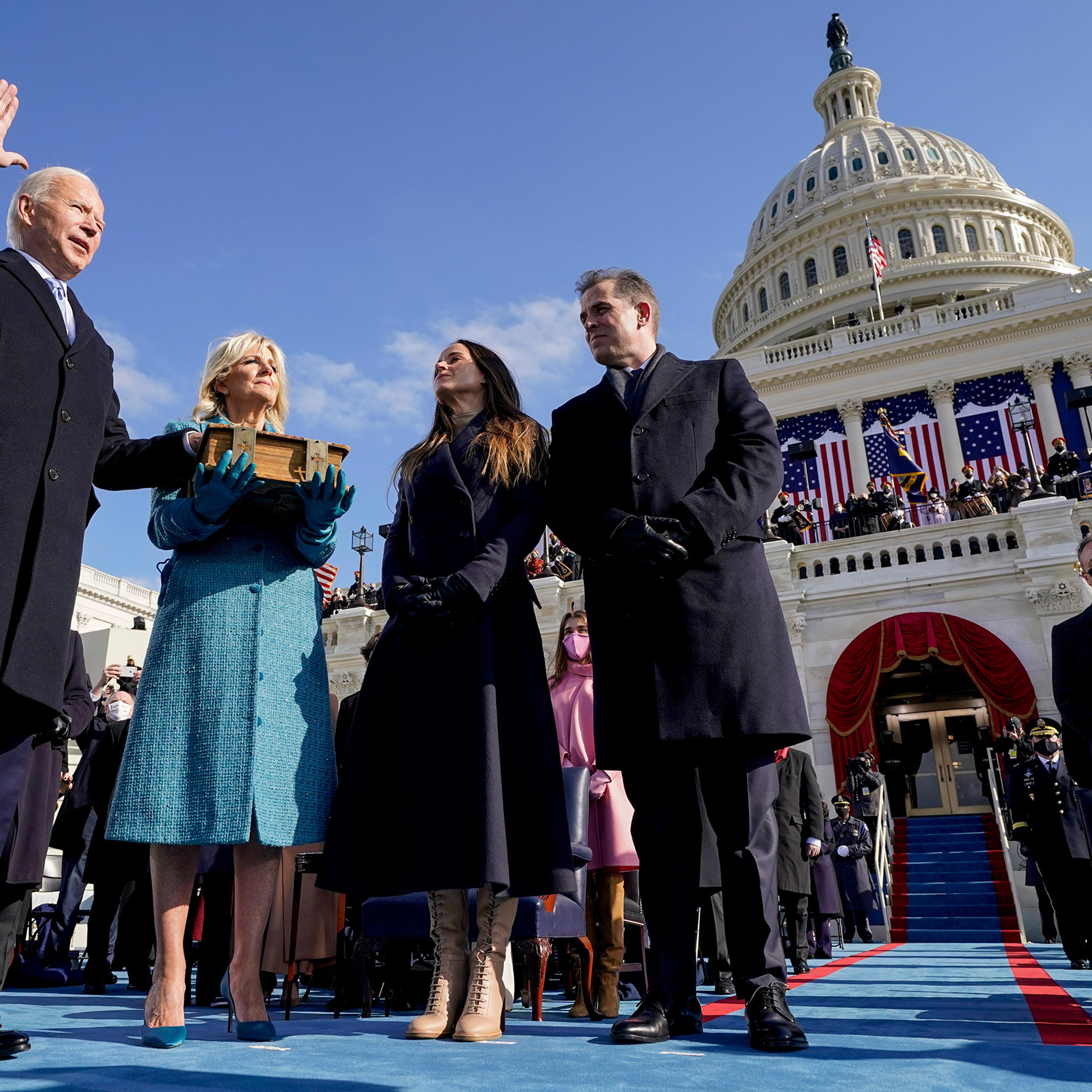 Joe Biden is sworn in as the 46th president of the United States by Chief Justice John Roberts as Jill Biden holds the Bible.