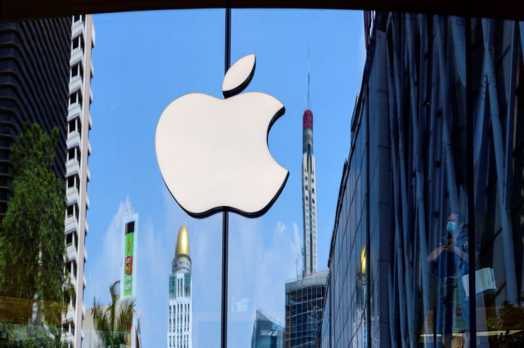 The Apple logo is seen on a window of the company's store in Bangkok on March 5, 2021.