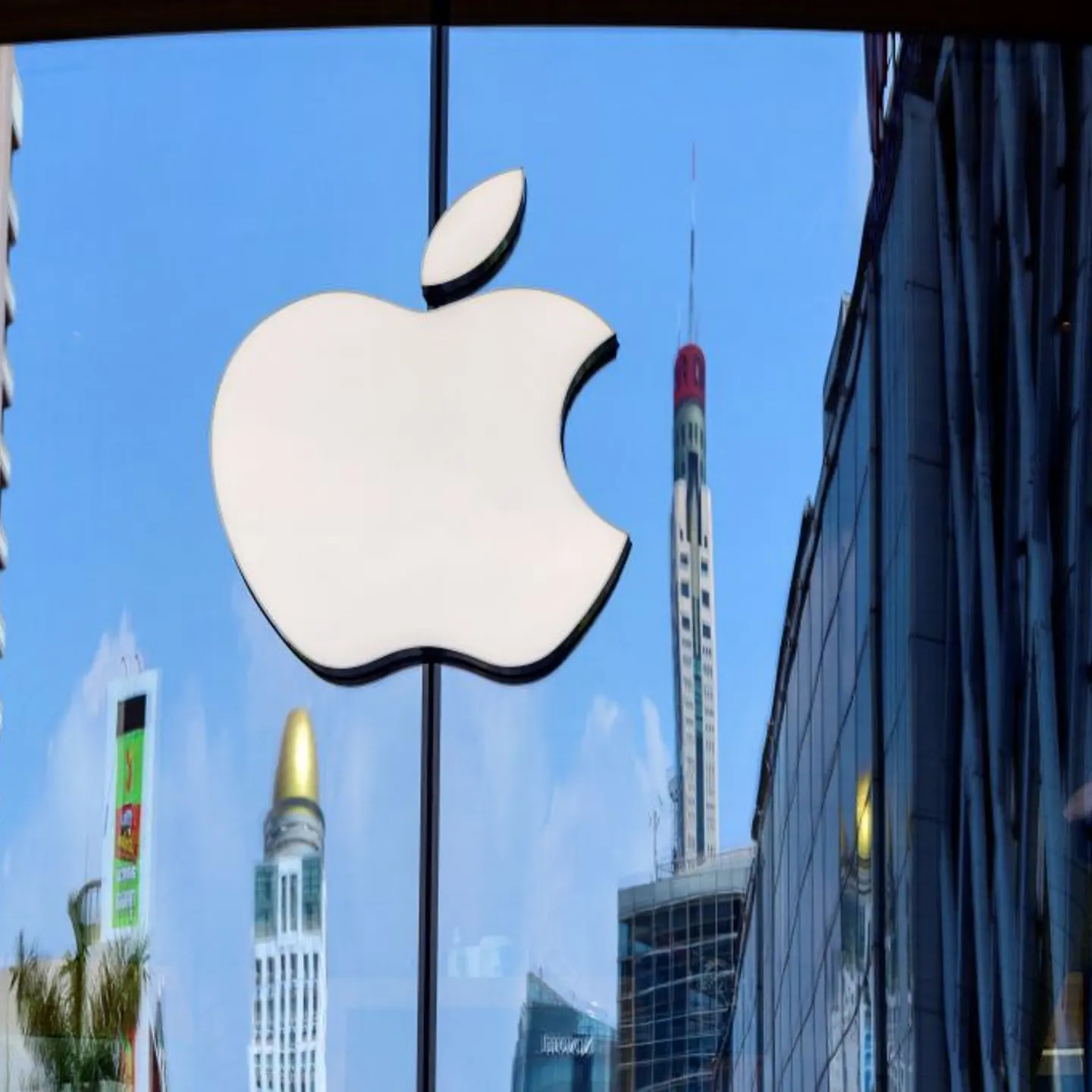 The Apple logo is seen on a window of the company's store in Bangkok on March 5, 2021.