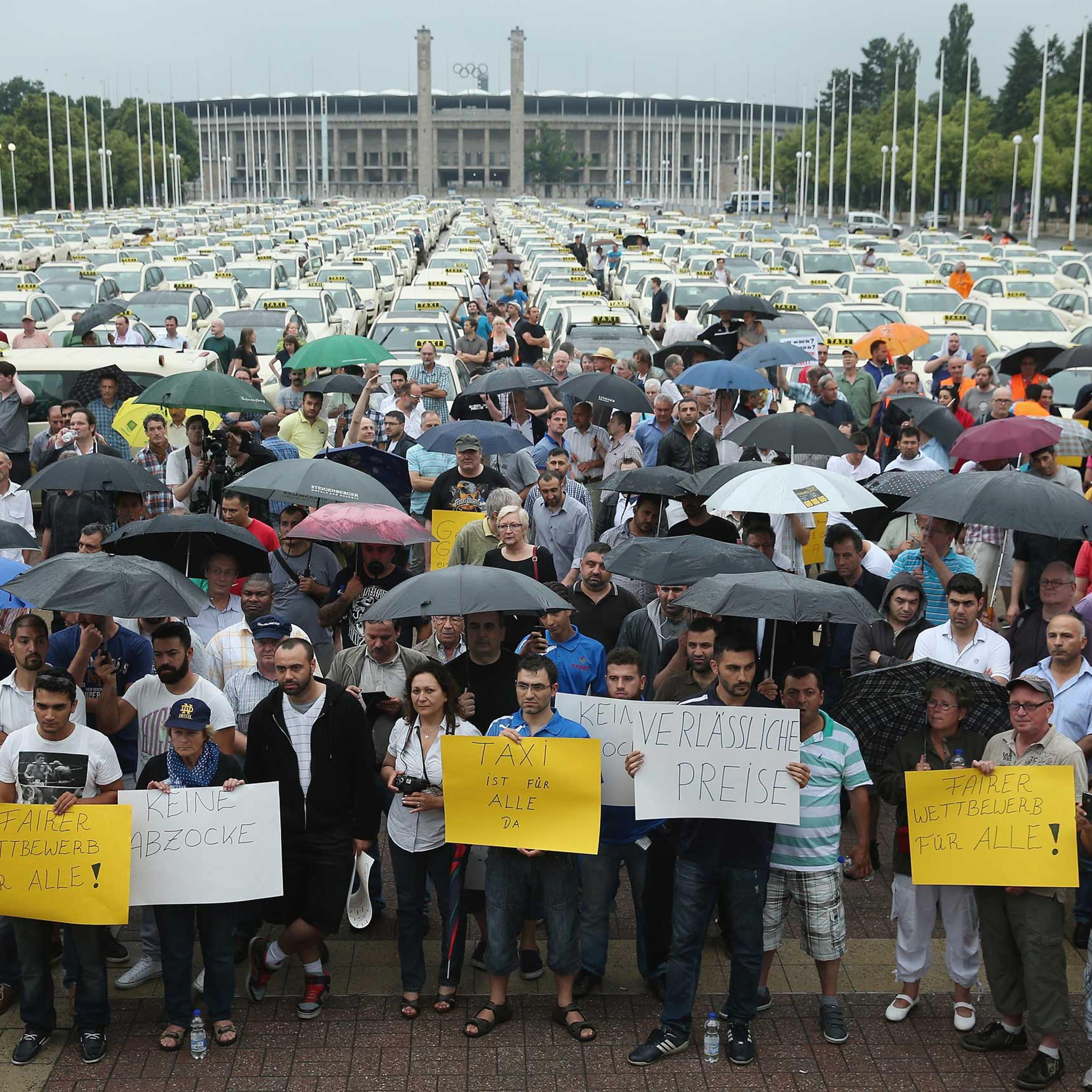 Hundreds of taxi drivers gather next to the Olympia Stadium to protest ride-sharing apps on June 11, 2014 in Berlin.