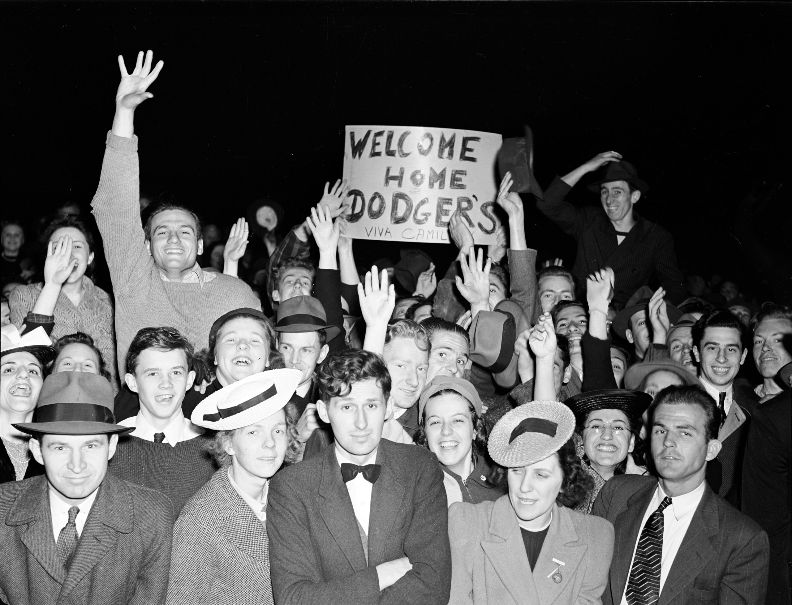 Brooklyn Dodger Fans cheering during game at Ebbets Field, Brooklyn, New York. May 1940.
