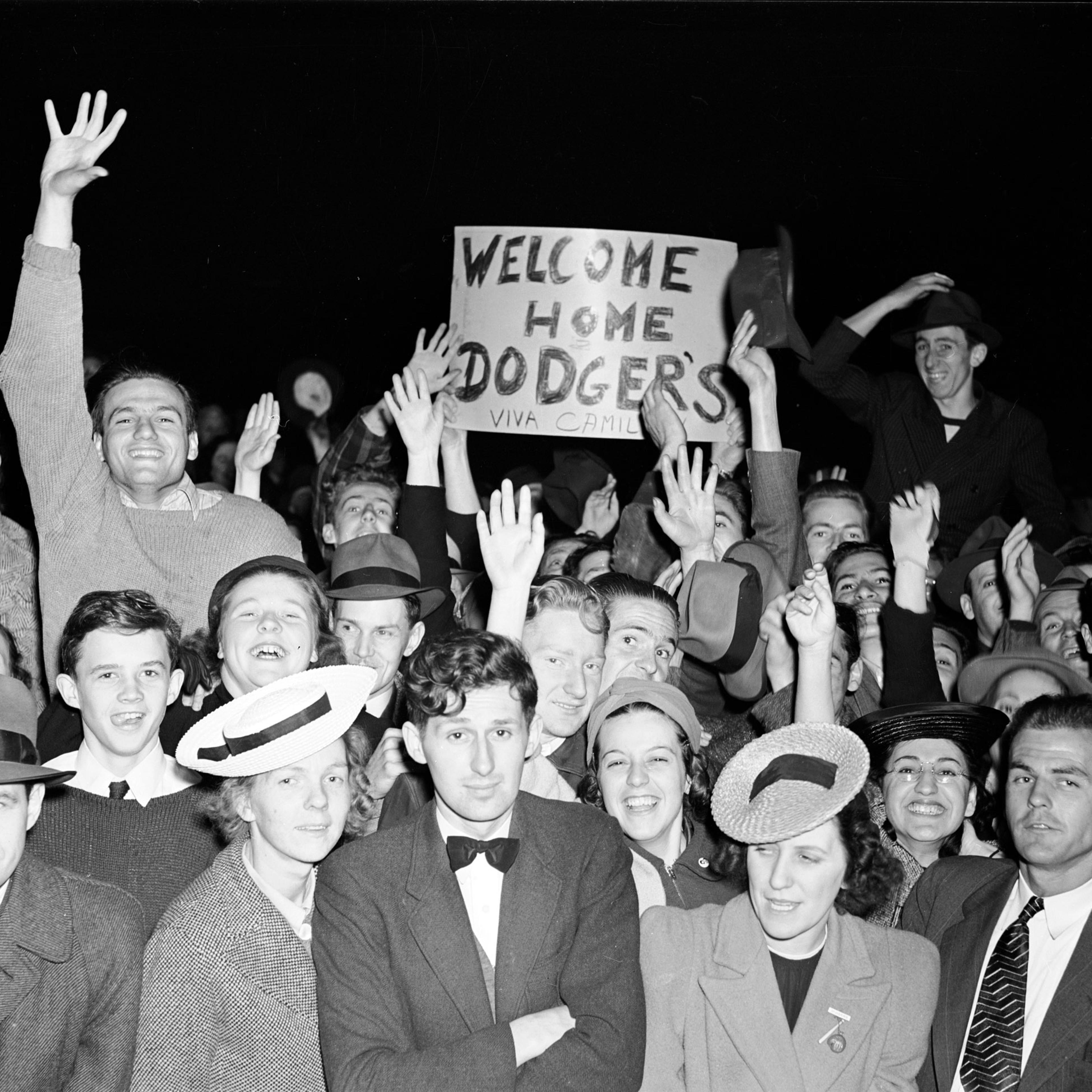 Brooklyn Dodger Fans cheering during game at Ebbets Field, Brooklyn, New York. May 1940.