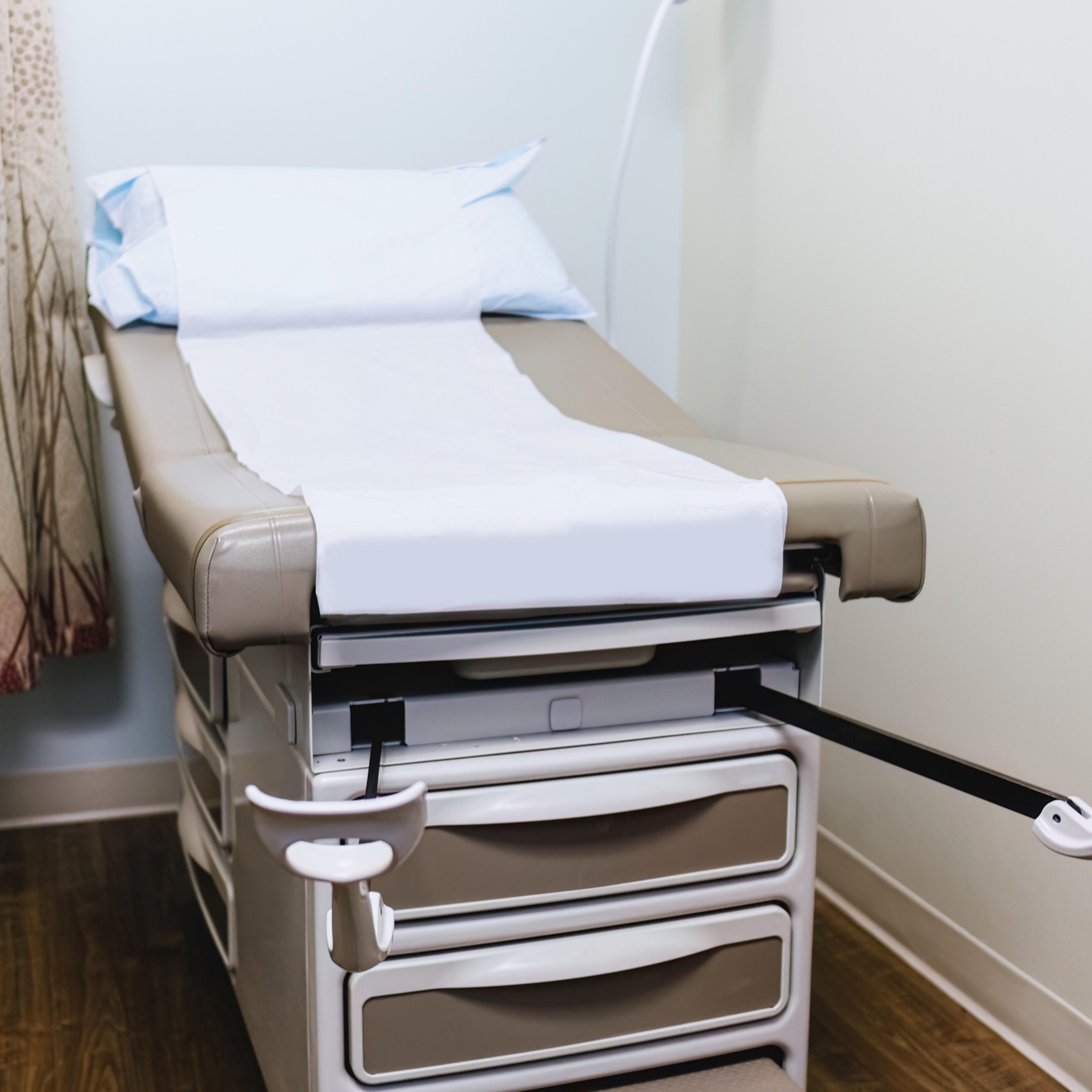 Examination Table With Stirrups in Gynecologist's Office