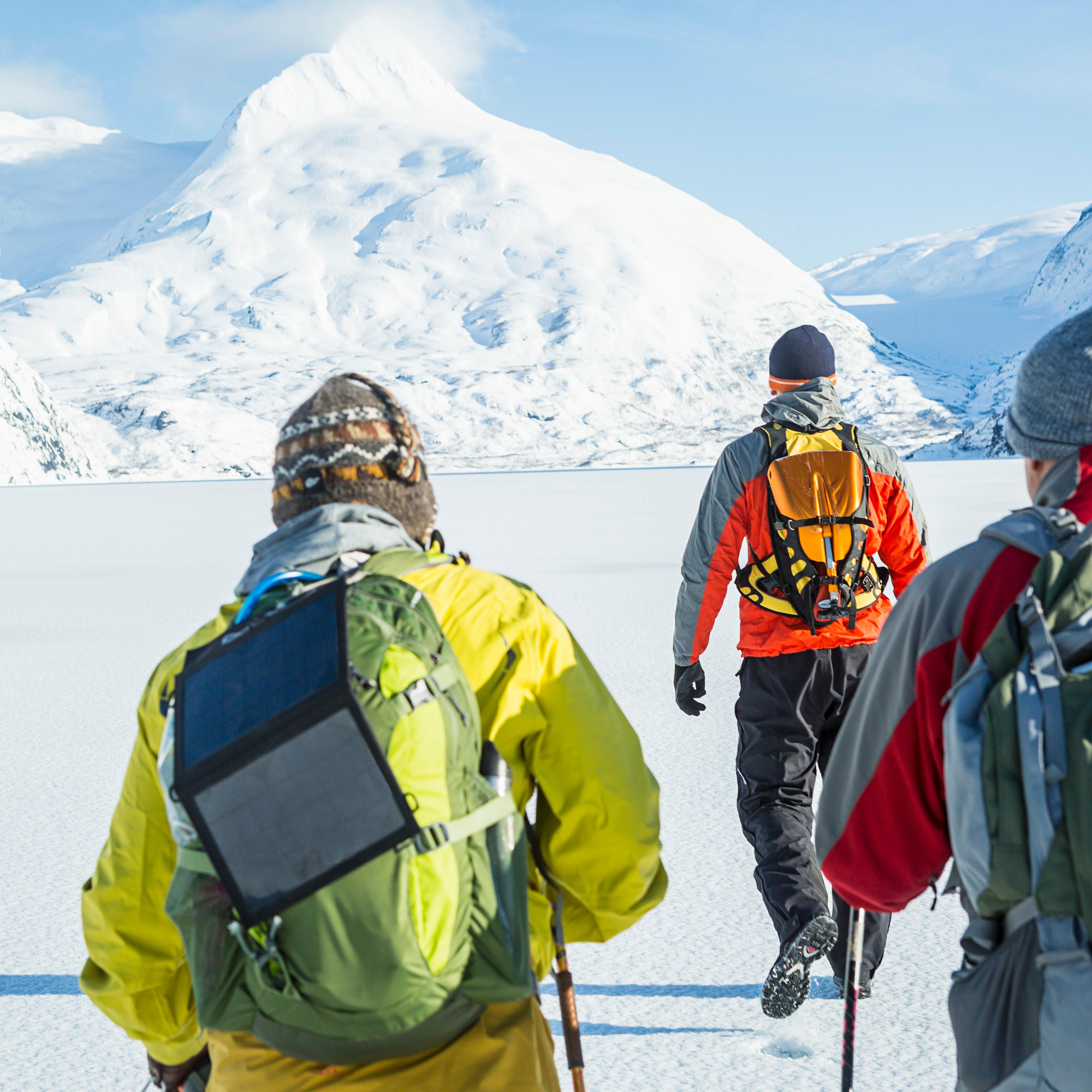 male-friends-hiking-mountain-winter