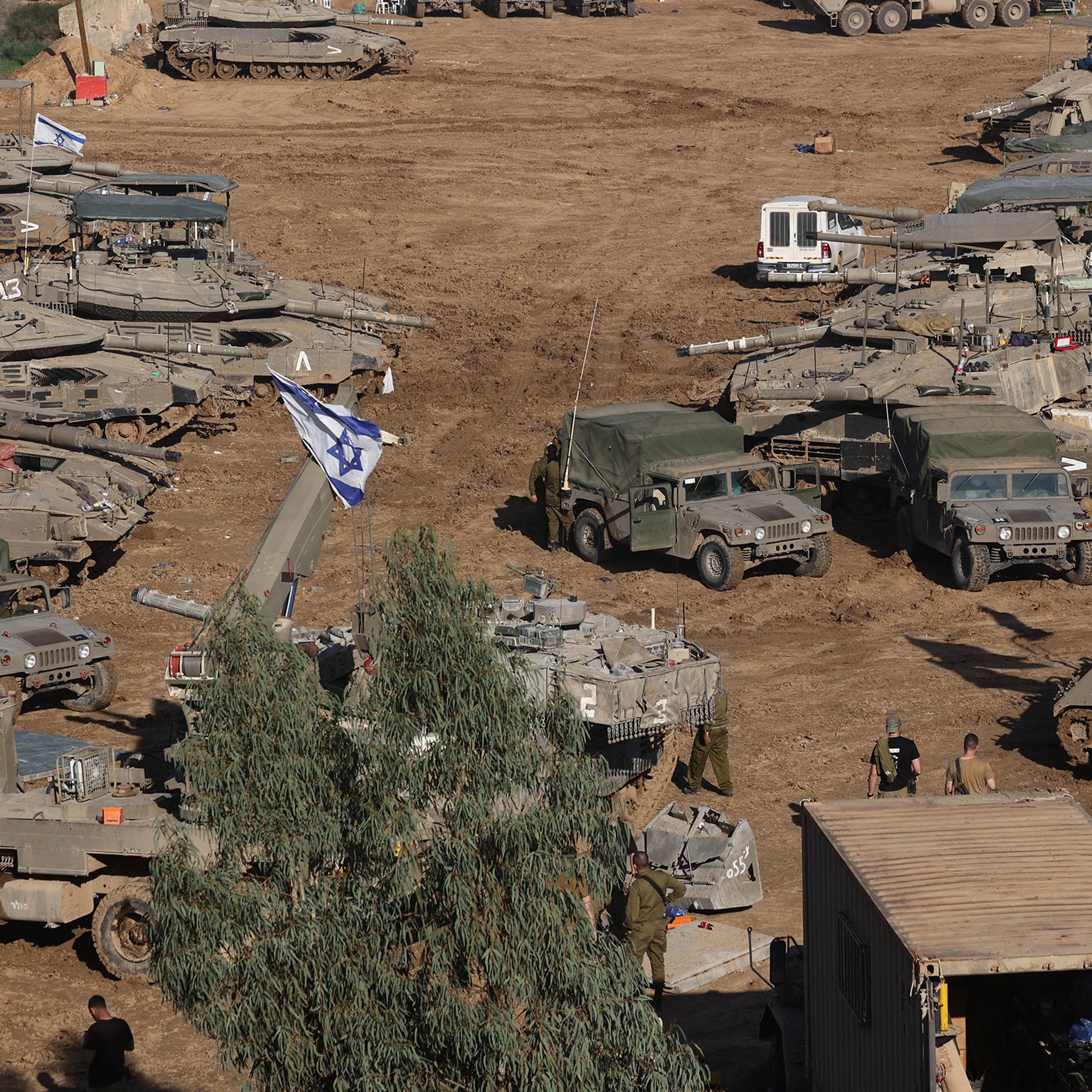 Israeli armored vehicles and troops are deployed in southern Israel, near the border with the Gaza Strip on Dec. 15, 2023.