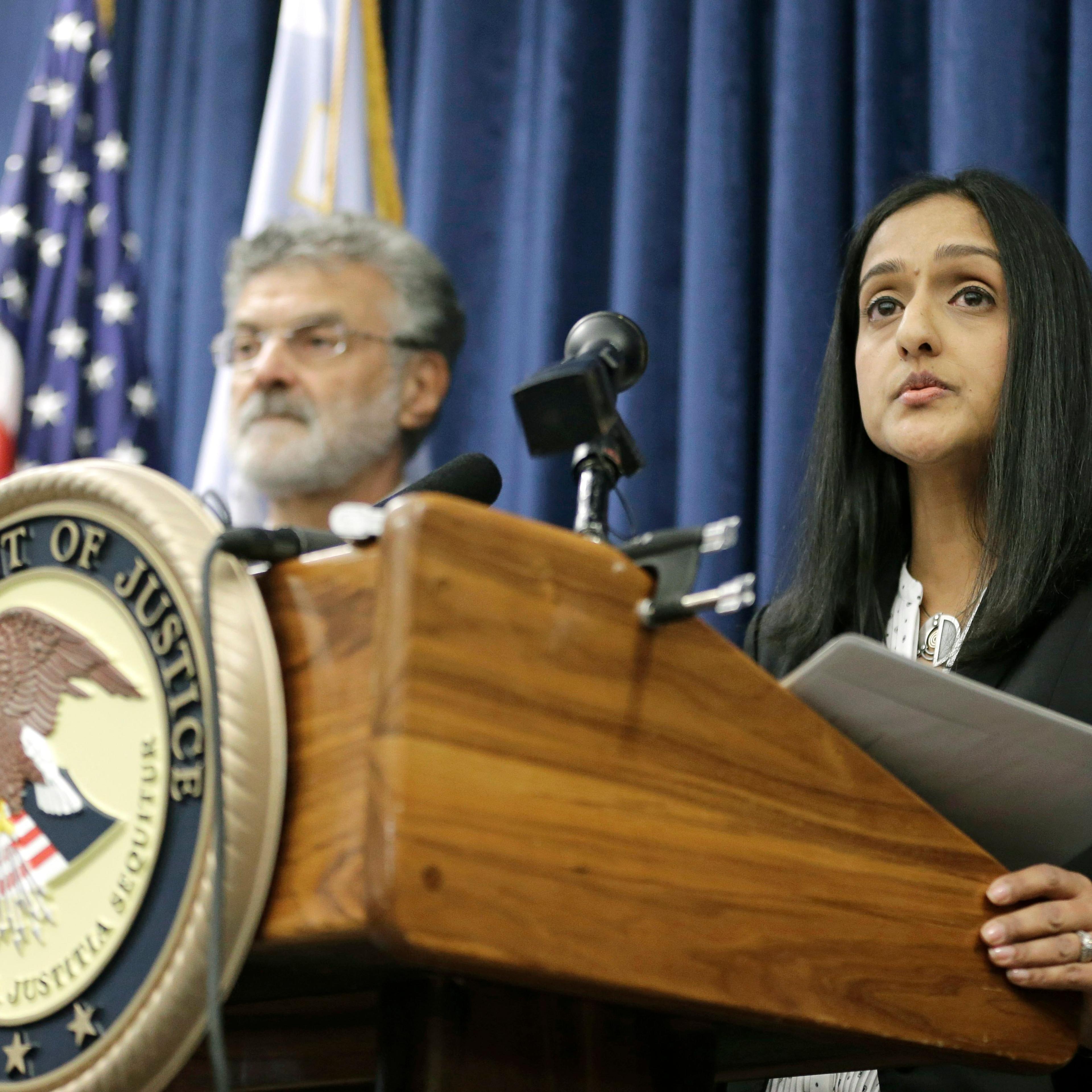 U.S. Acting Assistant Attorney General Vanita Gupta for the Civil Rights Division, right, makes a statement during a news conference on Dec. 4, 2014, in Cleveland.
