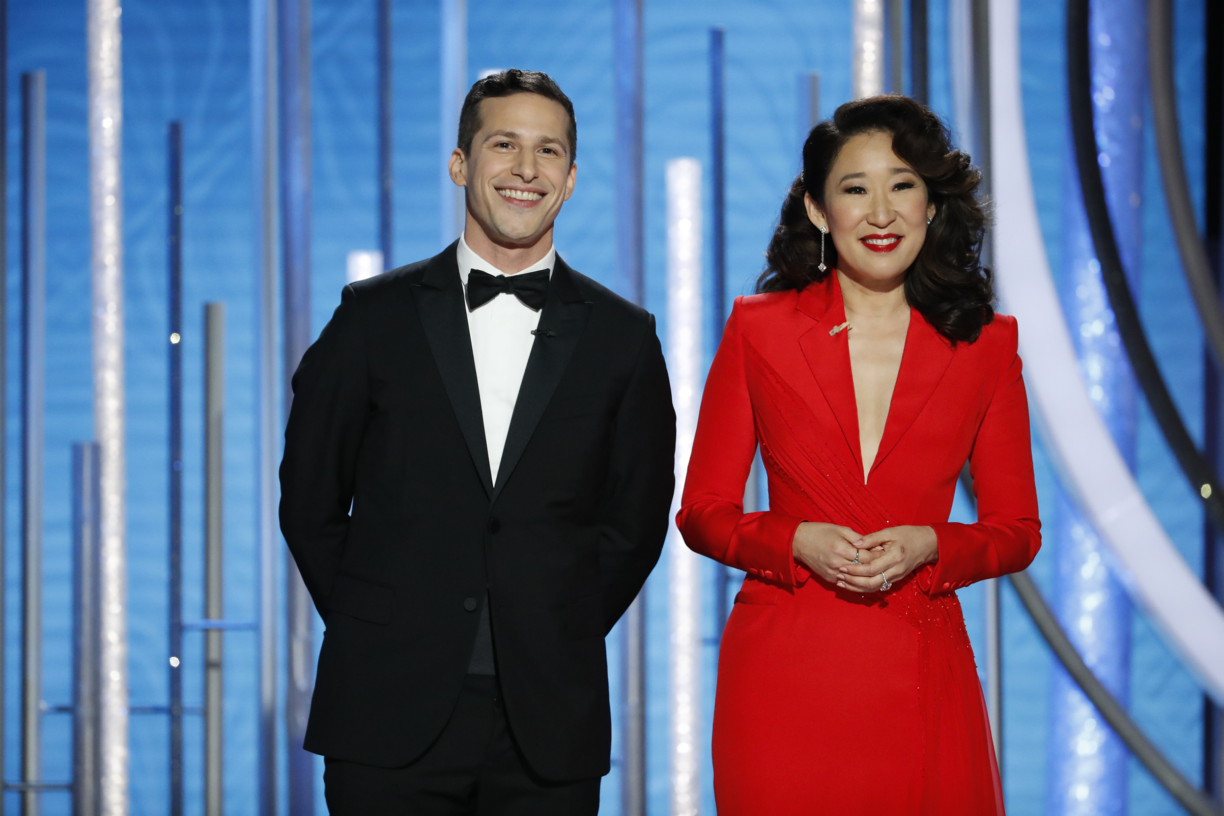 Hosts Andy Samberg and Sandra Oh speak onstage during the 76th Annual Golden Globe Awards