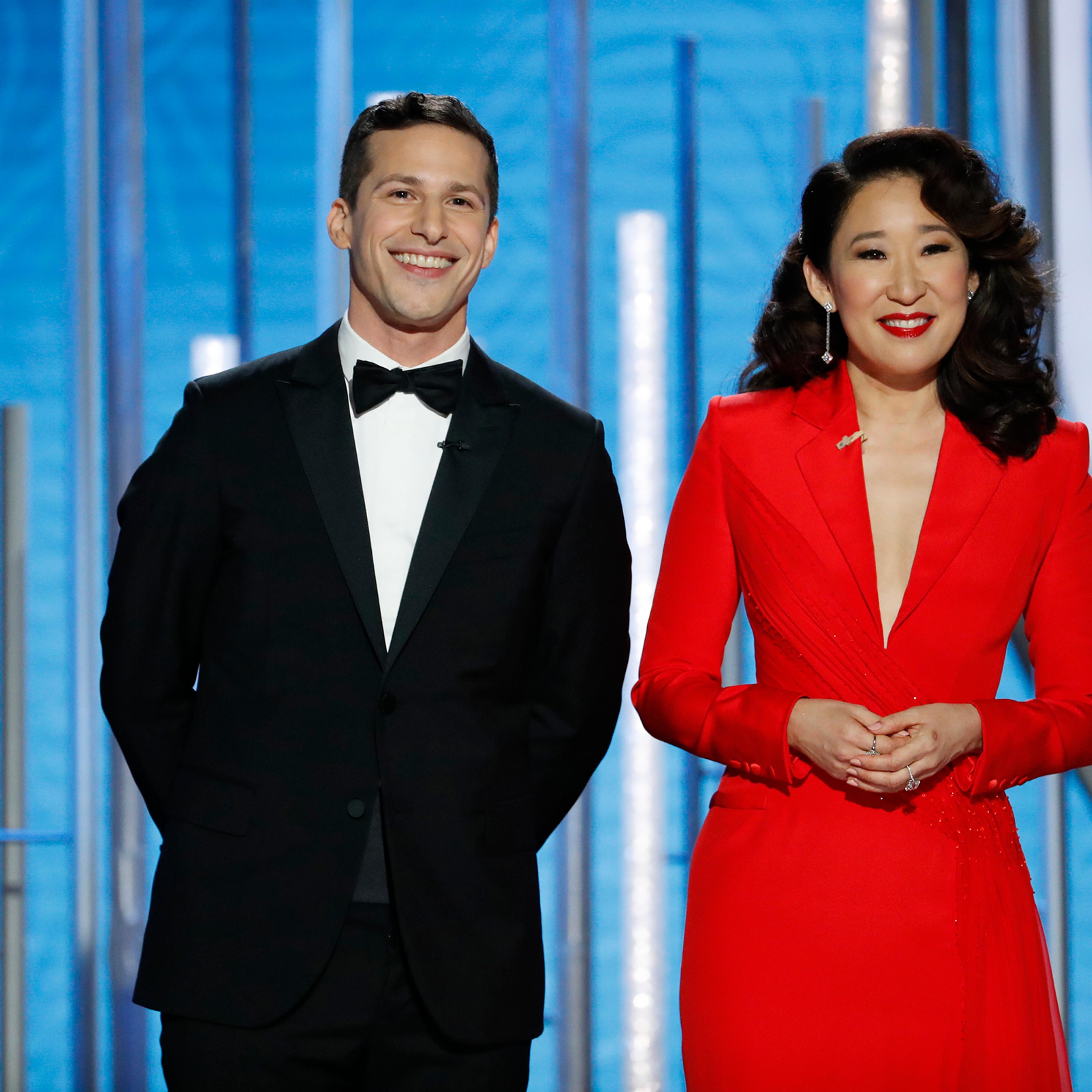Hosts Andy Samberg and Sandra Oh speak onstage during the 76th Annual Golden Globe Awards