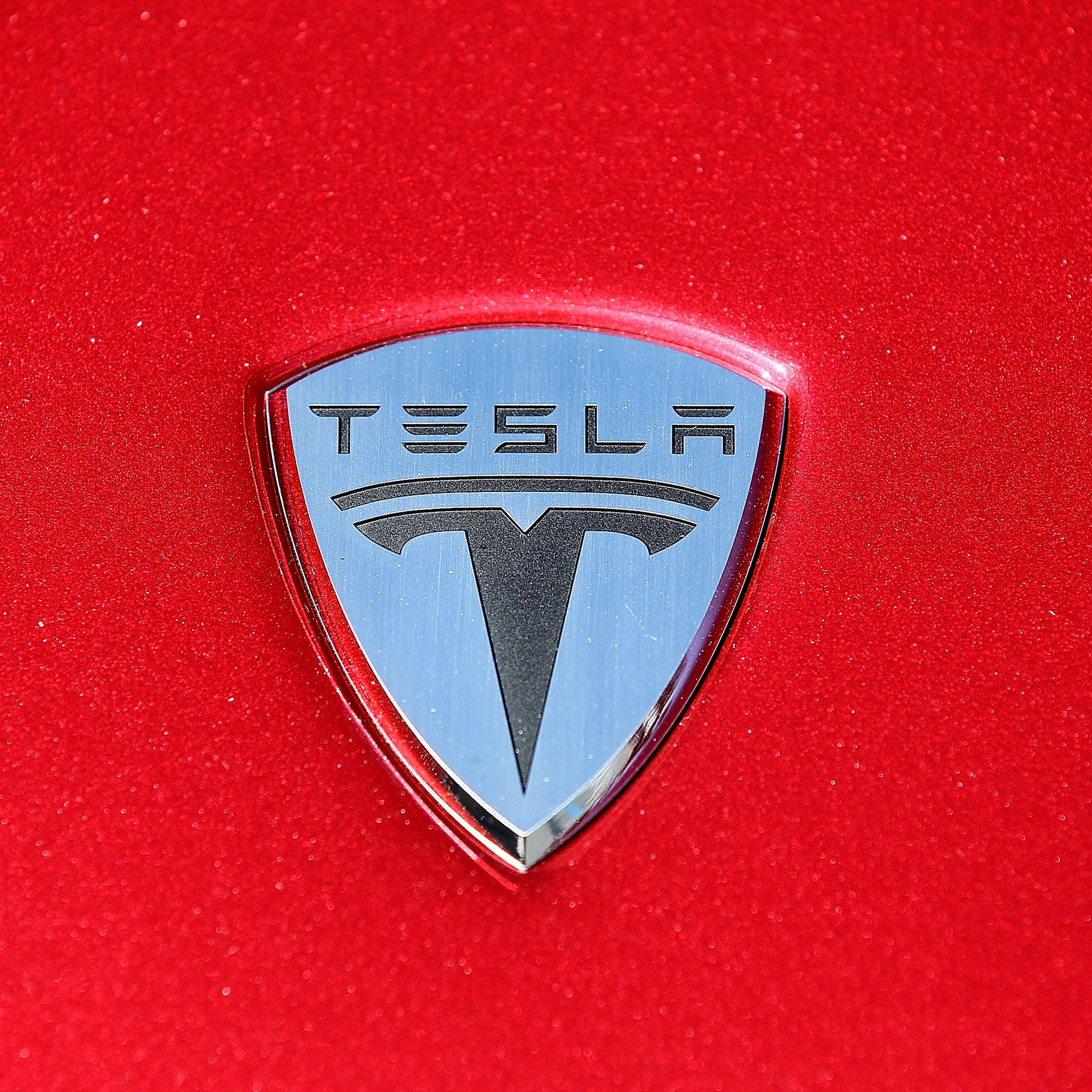 The Tesla Motors logo is seen on the hood of a car at Tesla Motors headquarters May 20, 2010 in Palo Alto, California.