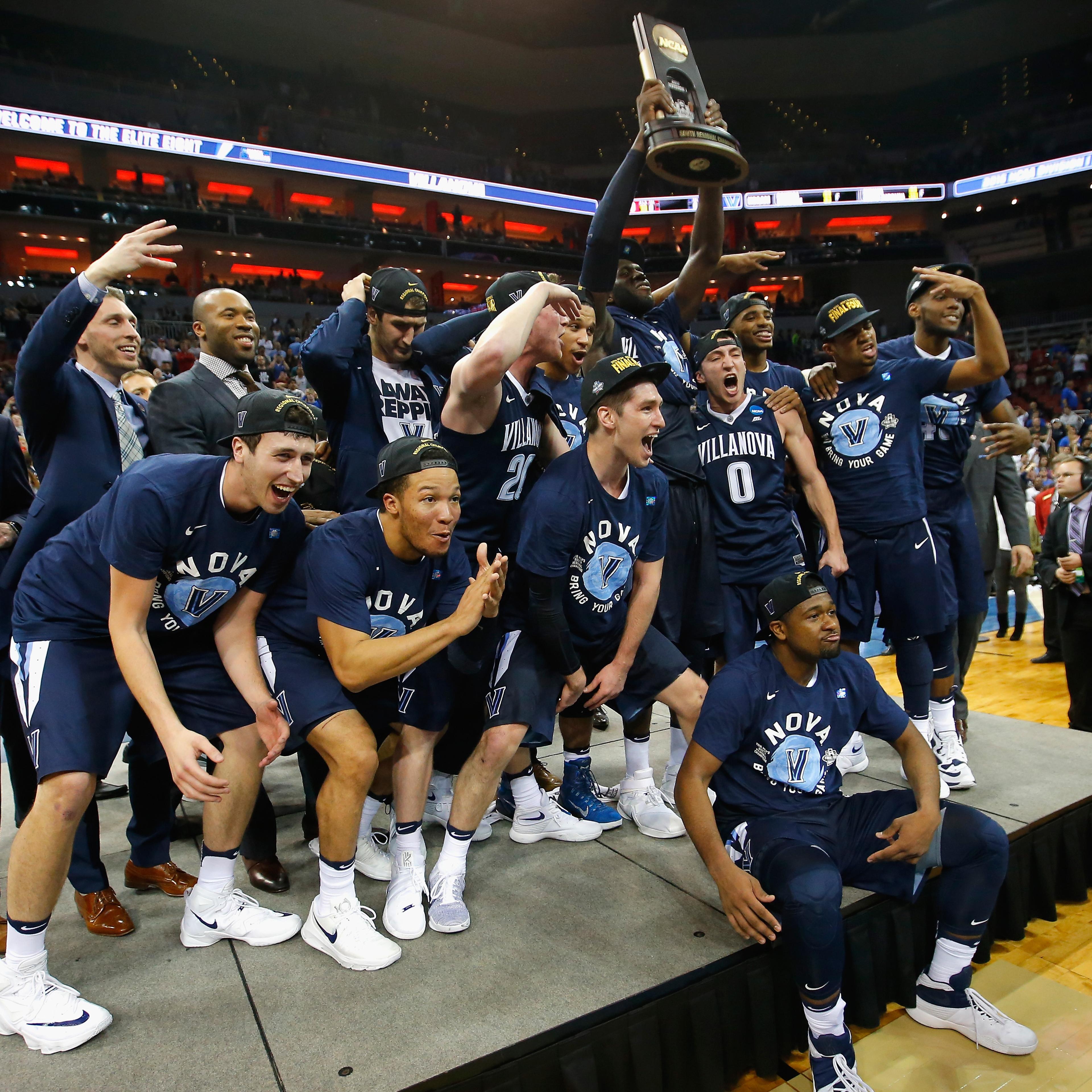 The Villanova Wildcats celebrate defeating the Kansas Jayhawks during the 2016 NCAA Men's Basketball Tournament South Regional on March 26, 2016 in Louisville, Ky.