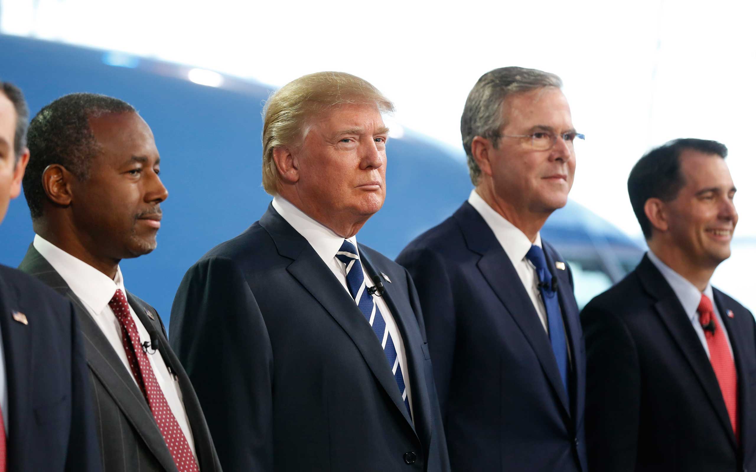 Republican U.S. presidential candidates Carson,Trump, Bush and Walker pose before the start of the second official Republican presidential candidates debate of the 2016 U.S. presidential campaign at the Ronald Reagan Presidential Library in Simi Valley