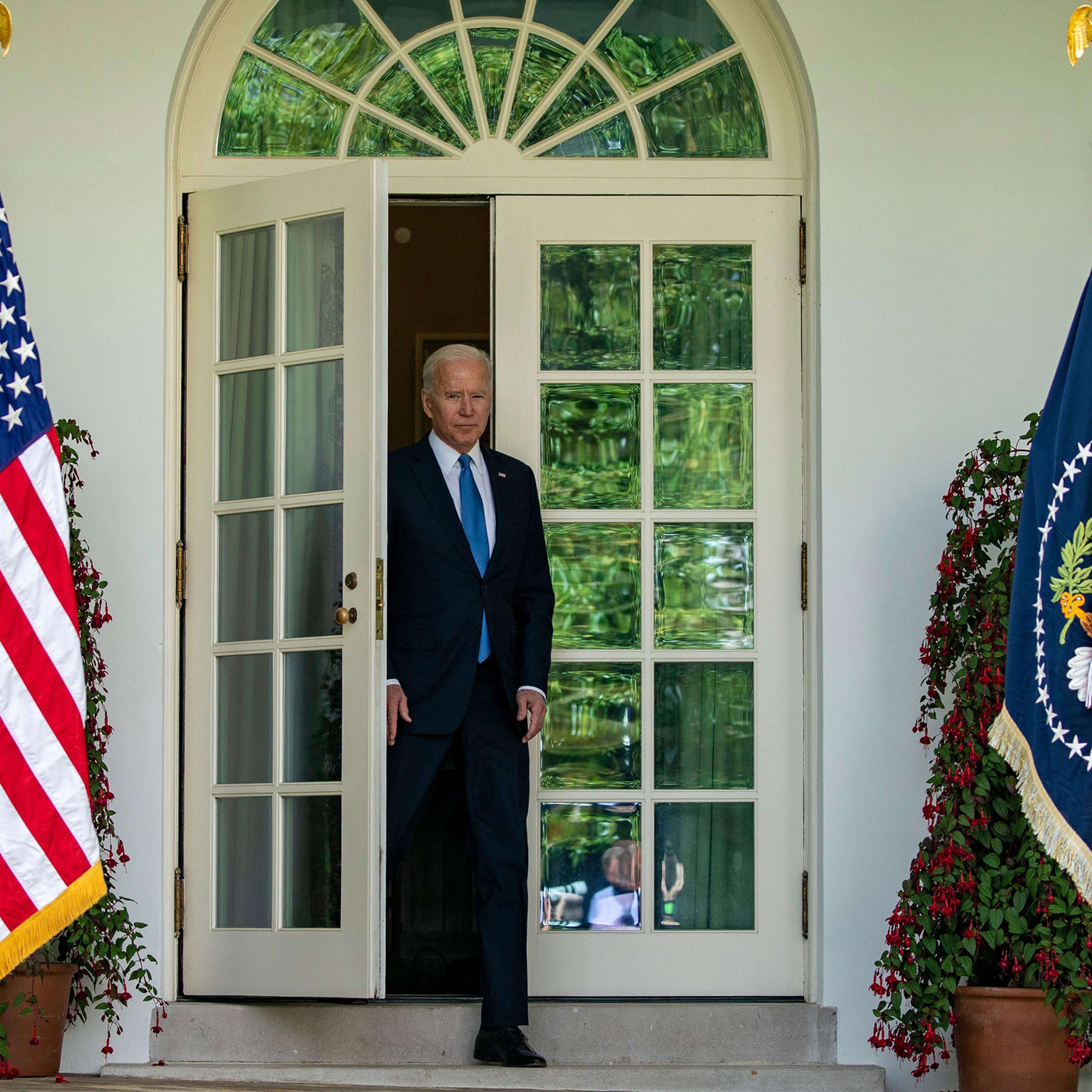 President Joe Biden enters the rose garden to give remarks May 13, 2021.