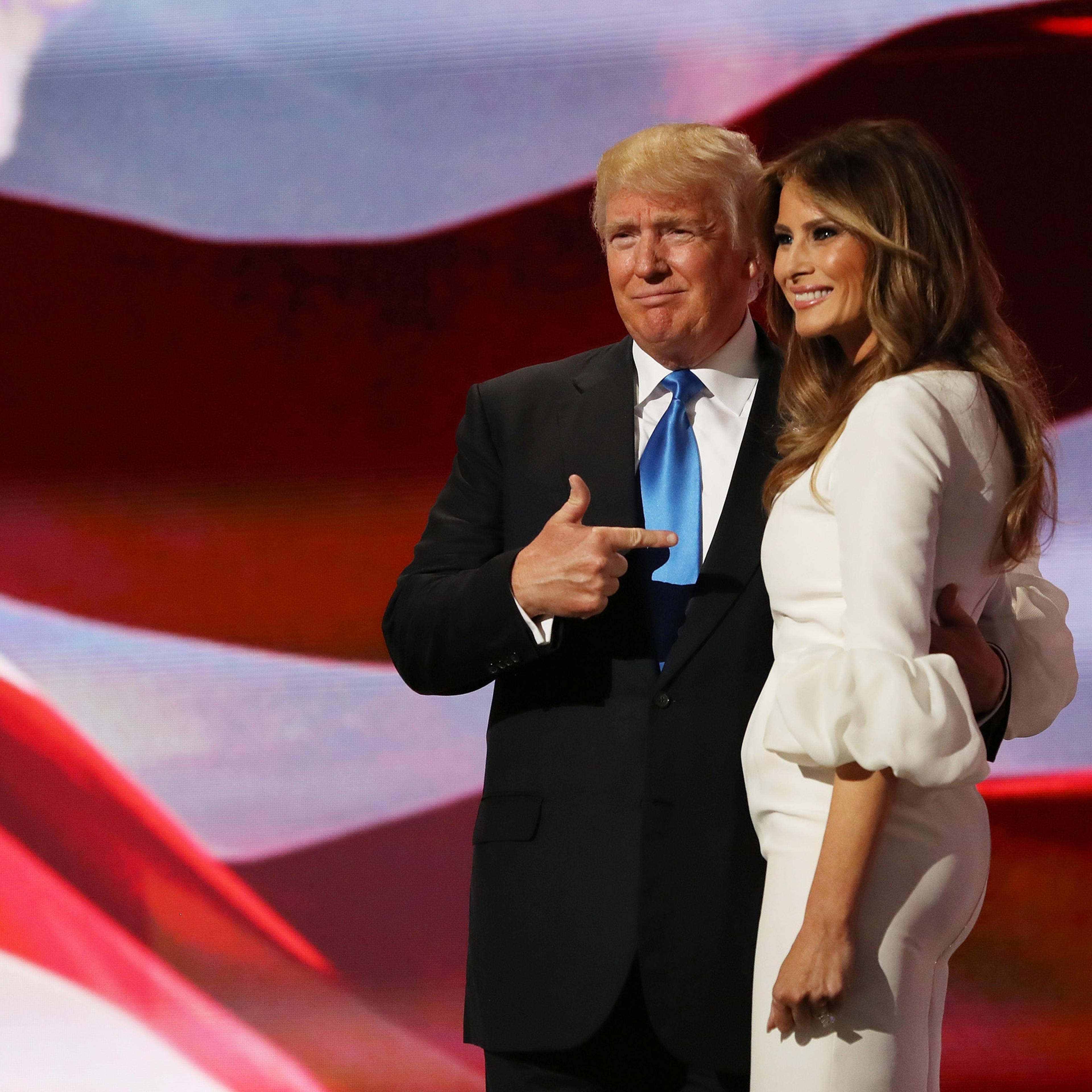 Republican presidential nominee Donald Trump gestures to his wife Melania after she delivered a speech on the first day of the Republican National Convention at the Quicken Loans Arena in Cleveland on July 18, 2016.