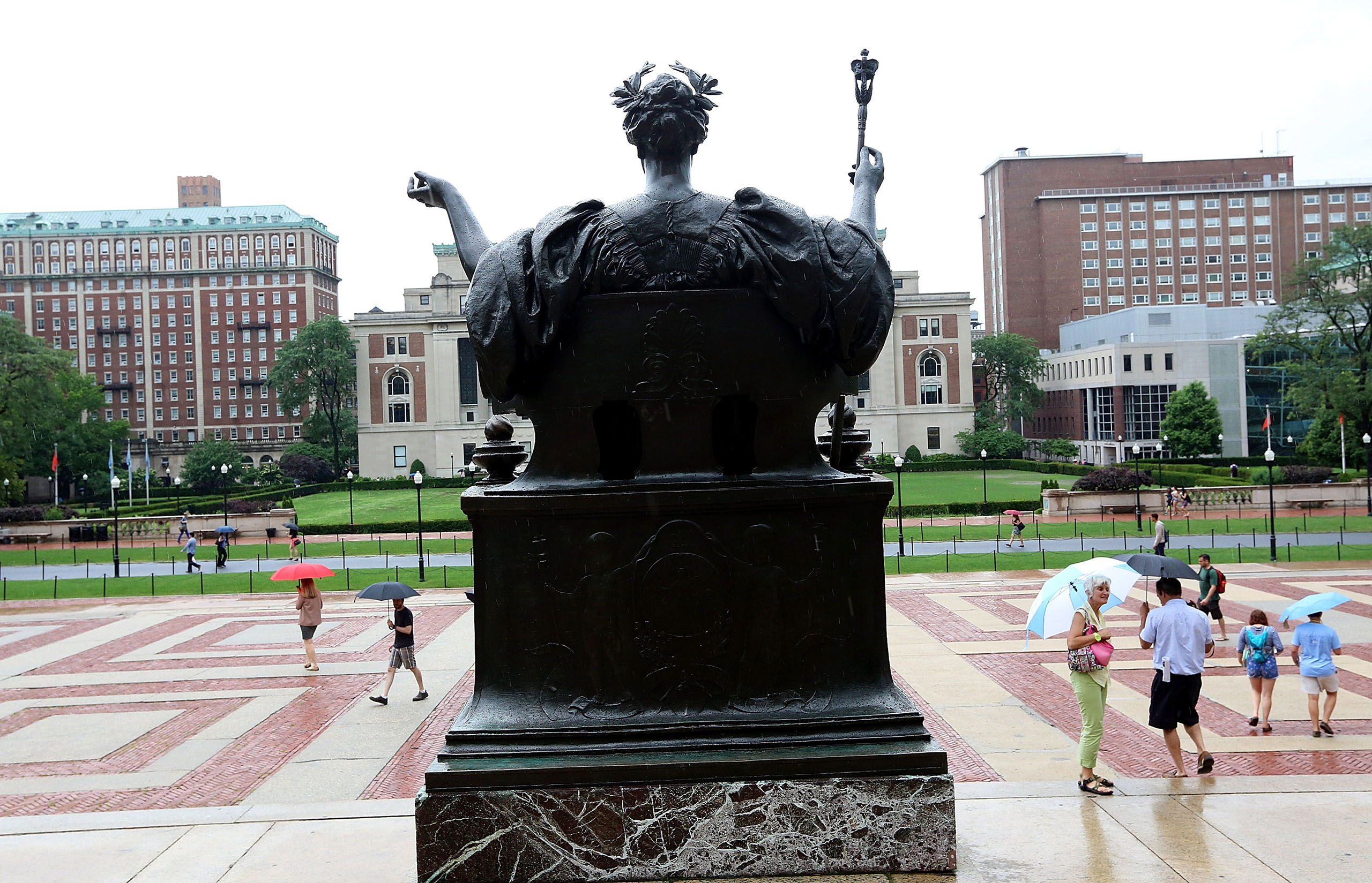 People walk on the Columbia University campus in New York City on July 1, 2013.