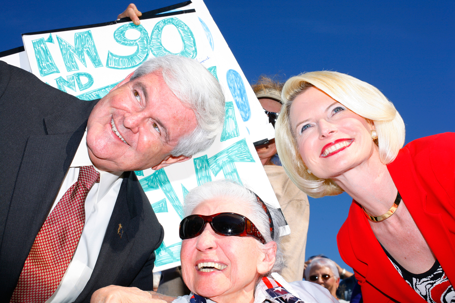 Newt and Callista Gingrich pose for photos during a rally at The Villages, Fla., January 29, 2012.