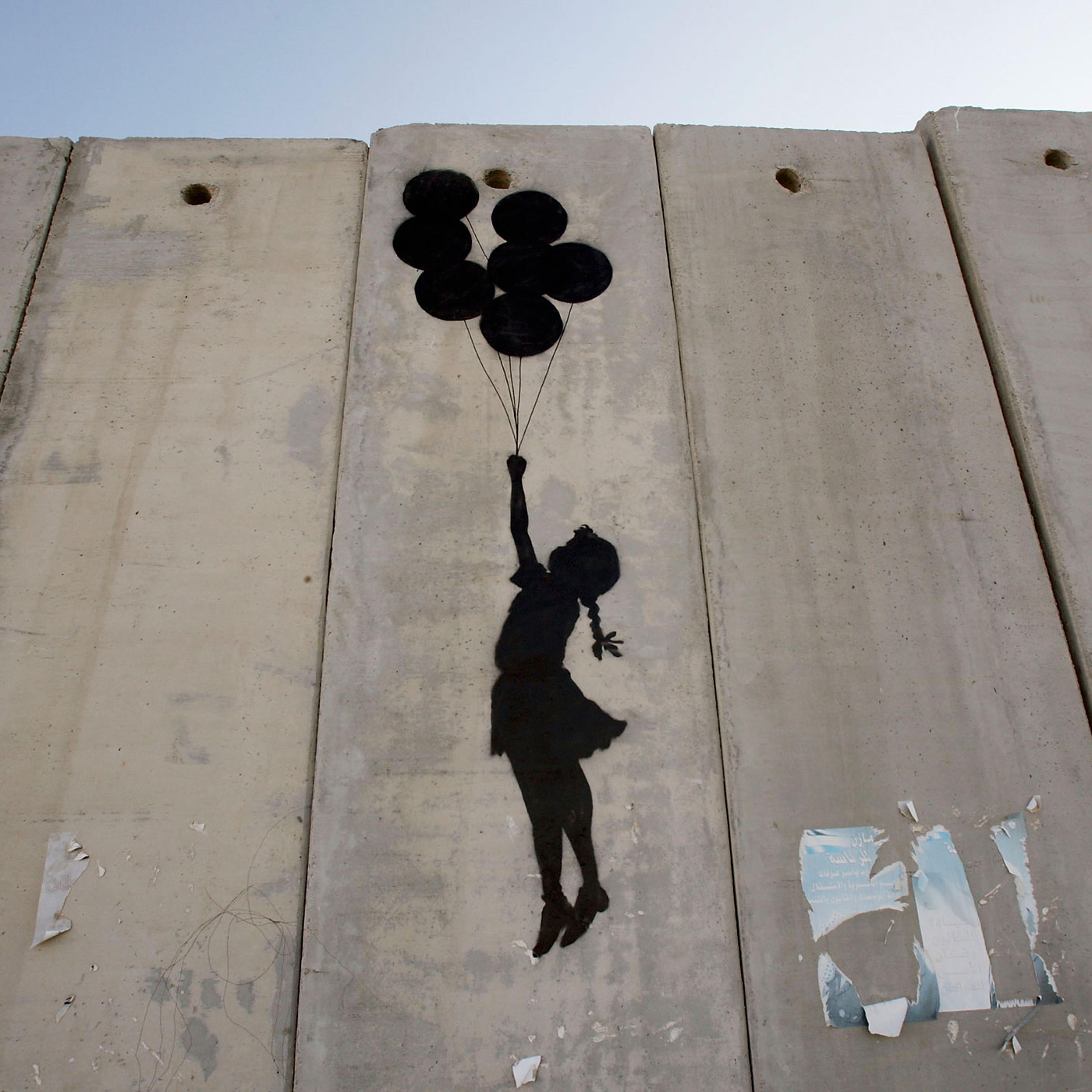 British Guerrilla Artist Decorates West Bank Barrier