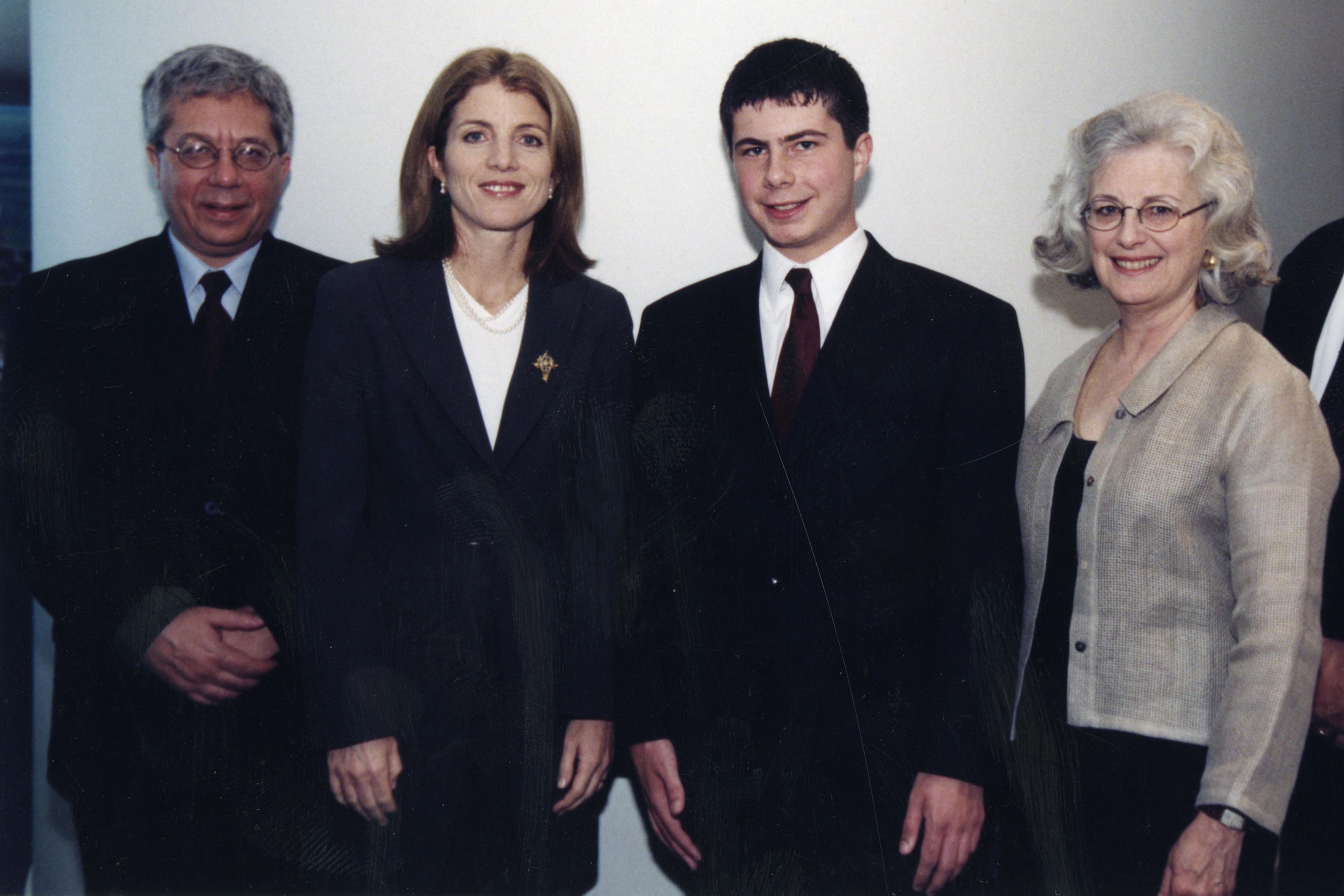 Buttigieg and his parents pose with Caroline Kennedy at the JFK Library in 2000. His high school essay on Senator Bernie Sanders won first place in the JFK Profiles in Courage contest.