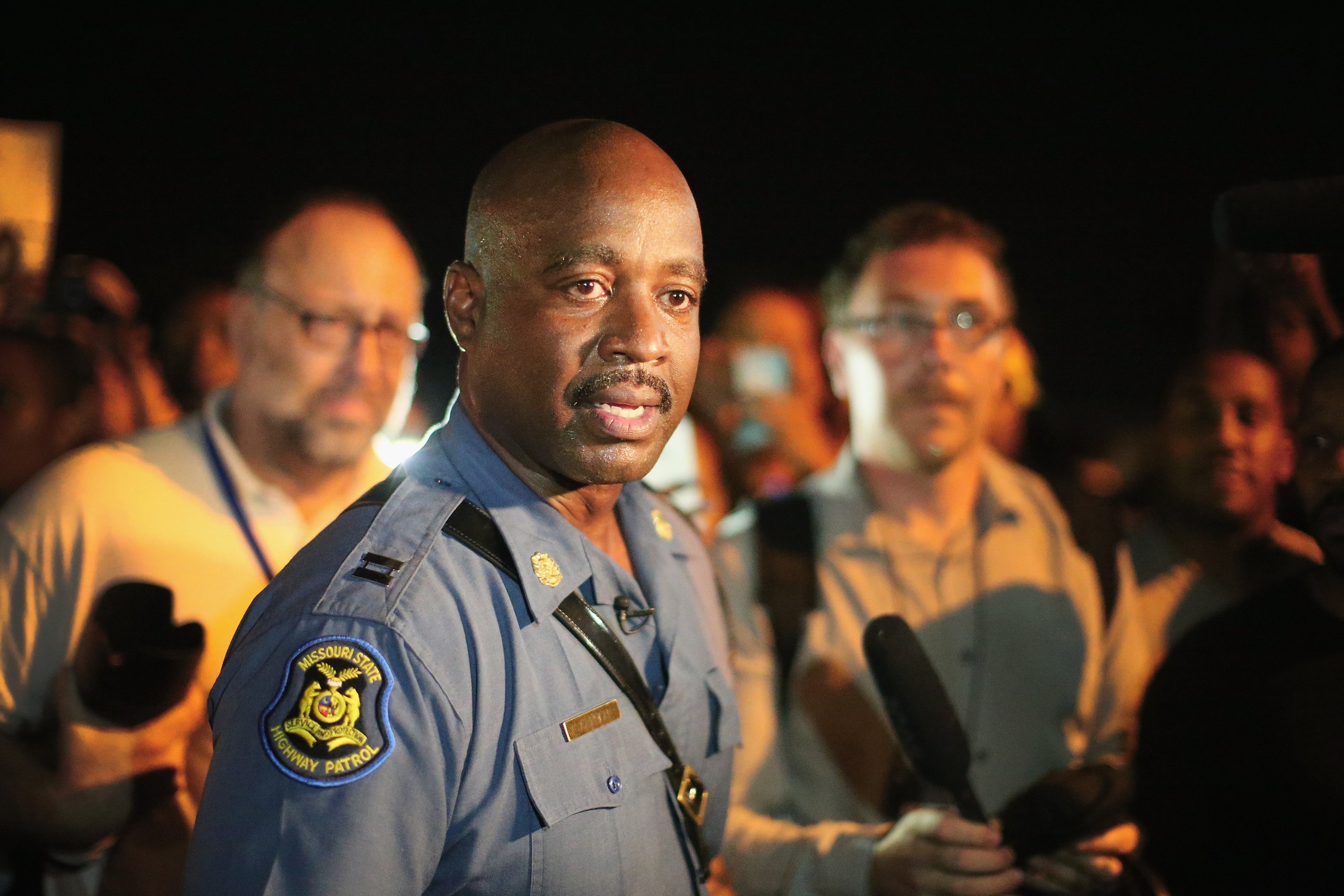 Capt. Ronald Johnson of the Missouri State Highway Patrol, who was appointed by the governor to take control of security operations in the city of Ferguson, walks among demonstrators gathered along West Florissant Avenue on August 14, 2014 in Ferguson, M