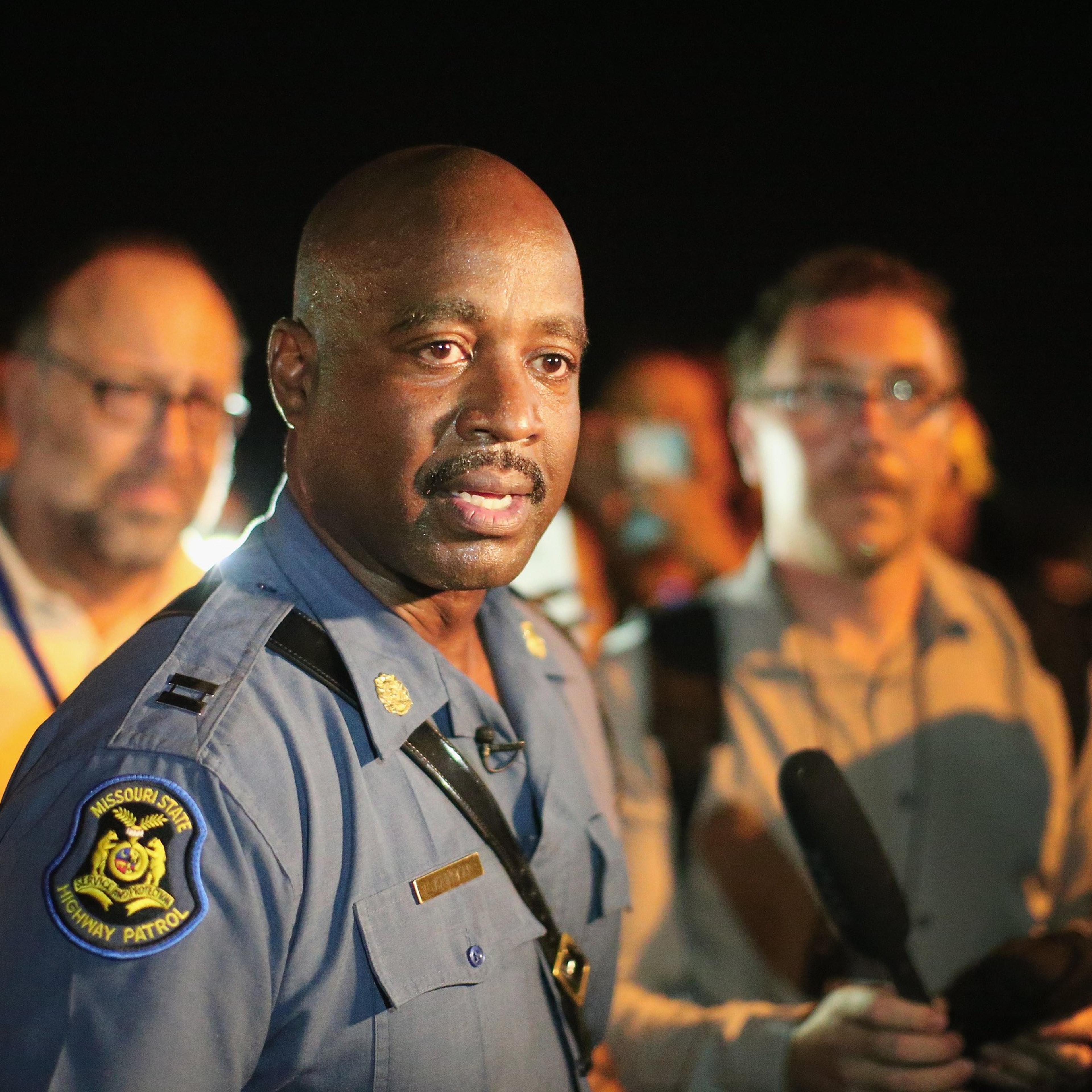 Capt. Ronald Johnson of the Missouri State Highway Patrol, who was appointed by the governor to take control of security operations in the city of Ferguson, walks among demonstrators gathered along West Florissant Avenue on August 14, 2014 in Ferguson, M