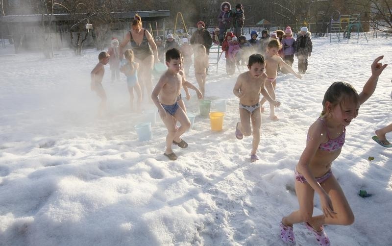 Children pour cold water on themselves during regular exercises in Krasnoyarsk