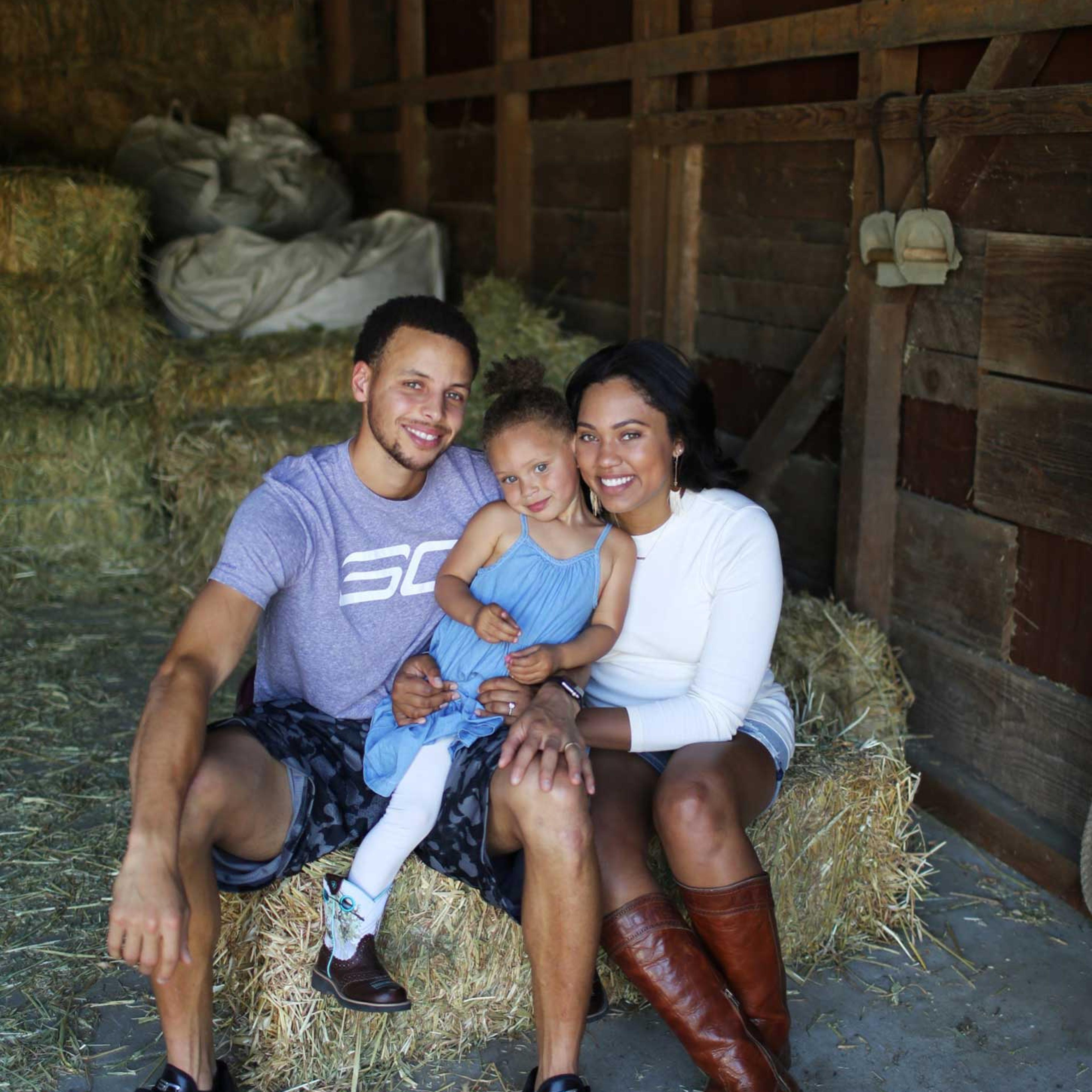 Ayesha and Stephen Curry with their daughter Riley in 2014.