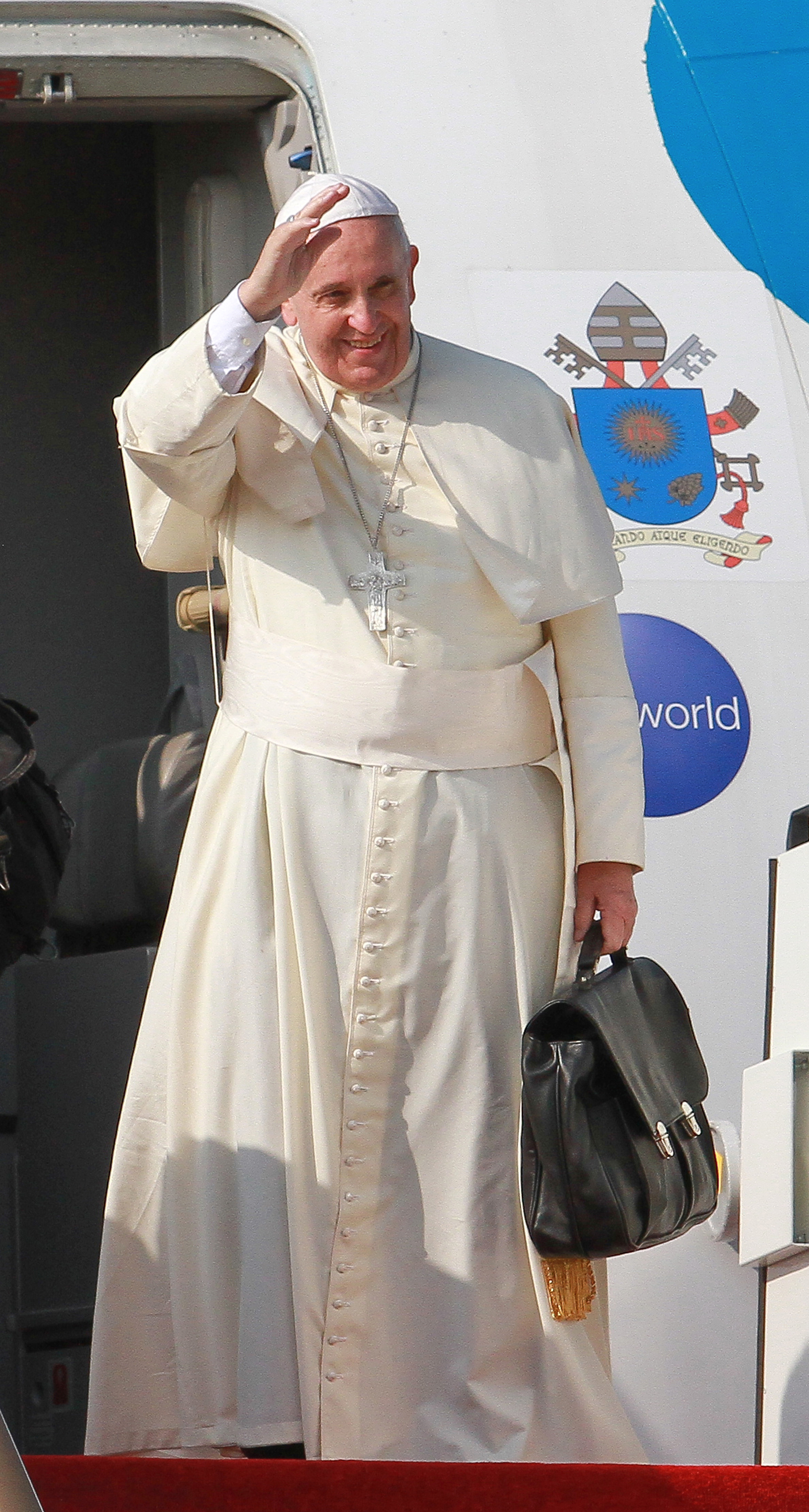 Pope Francis waves during the departure ceremony at the Bandaranaike International Airport in Colombo, Sri Lank on Jan. 15, 2015.