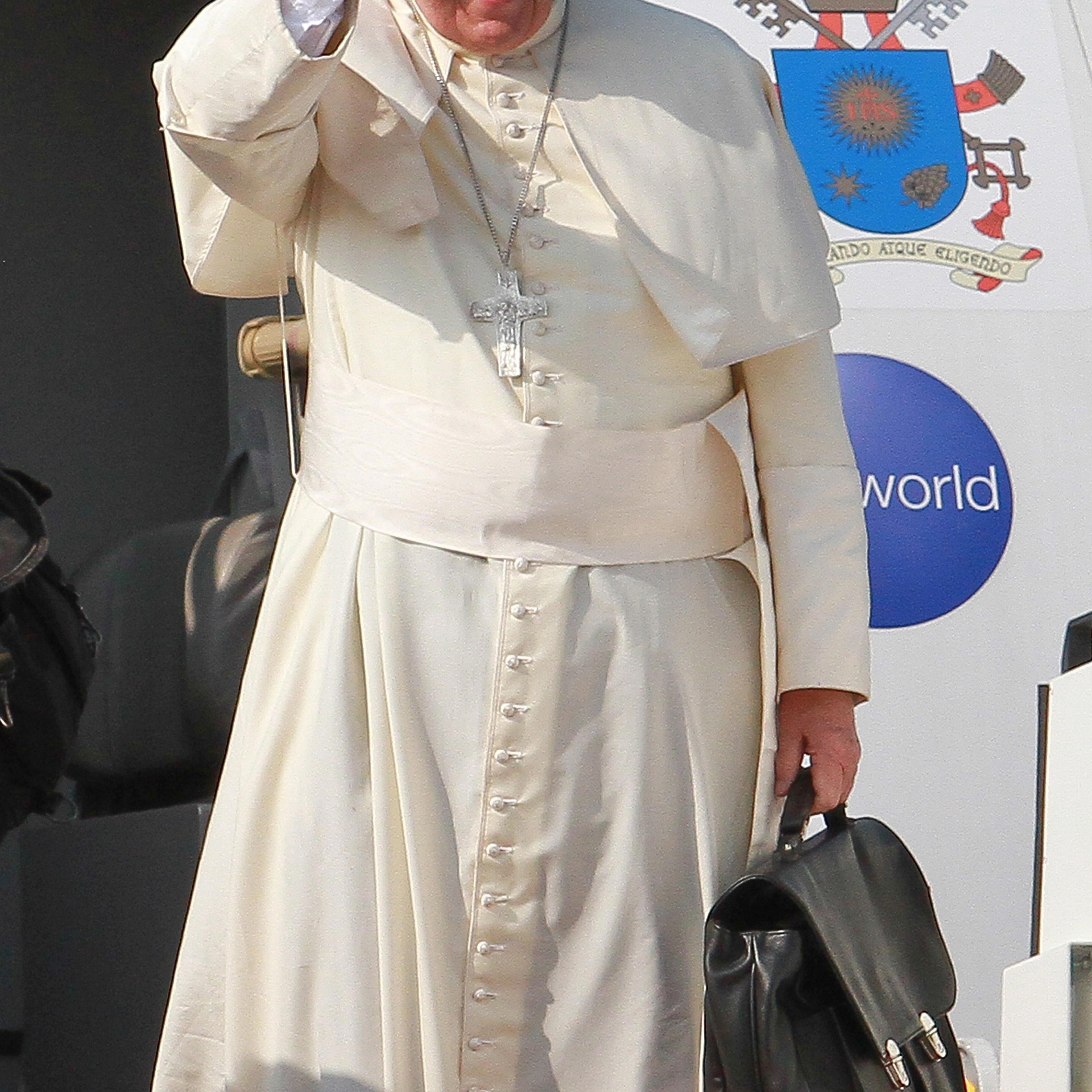 Pope Francis waves during the departure ceremony at the Bandaranaike International Airport in Colombo, Sri Lank on Jan. 15, 2015.