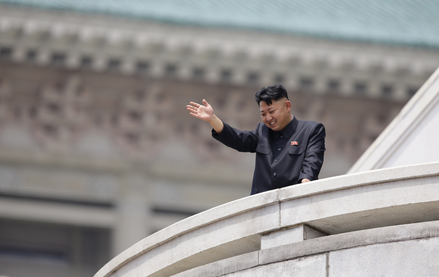 North Korean leader Kim Jong-un waves to the people during a parade to commemorate the 60th anniversary of the signing of a truce in the 1950-1953 Korean War, at Kim Il-sung Square in Pyongyang July 27, 2013.